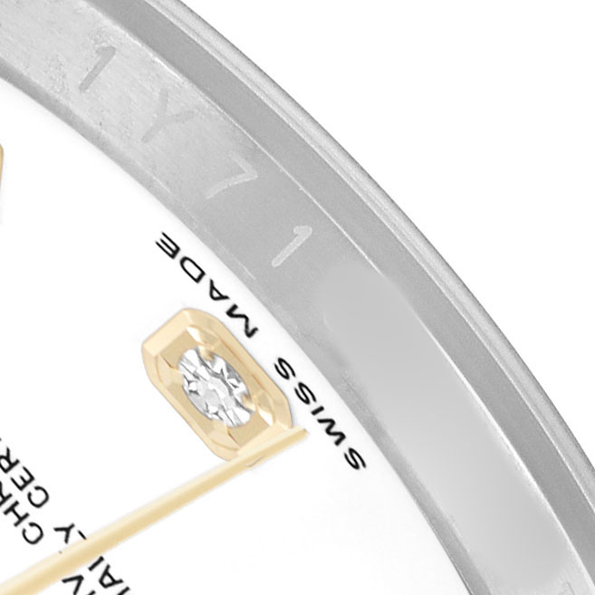 The image shows a close-up of the Rolex Datejust 116233 Men's Steel and Gold (two tone) White Dial watch dial, highlighting a diamond hour marker and partial bezel.