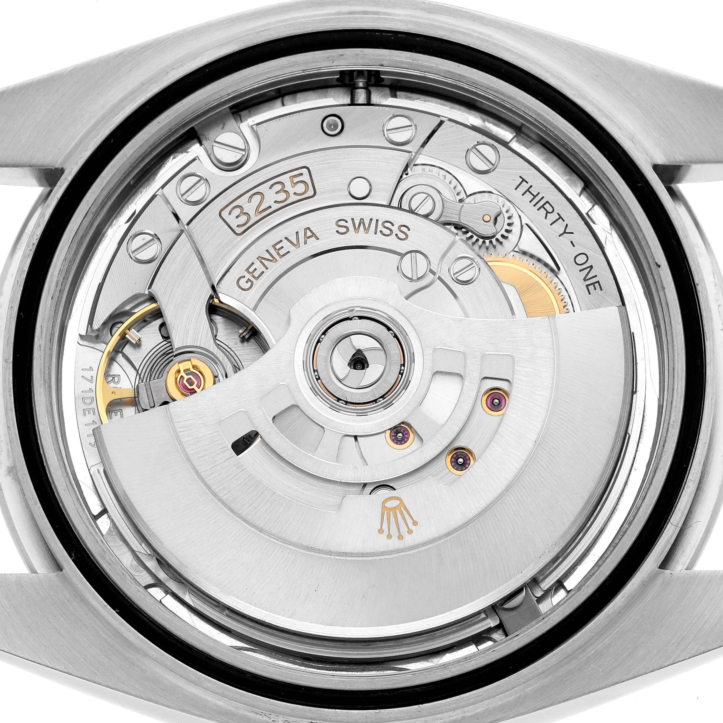 The image shows the open back of a Rolex Datejust 126300 Men
s Stainless Steel Silver Dial, revealing the automatic movement and caliber details.