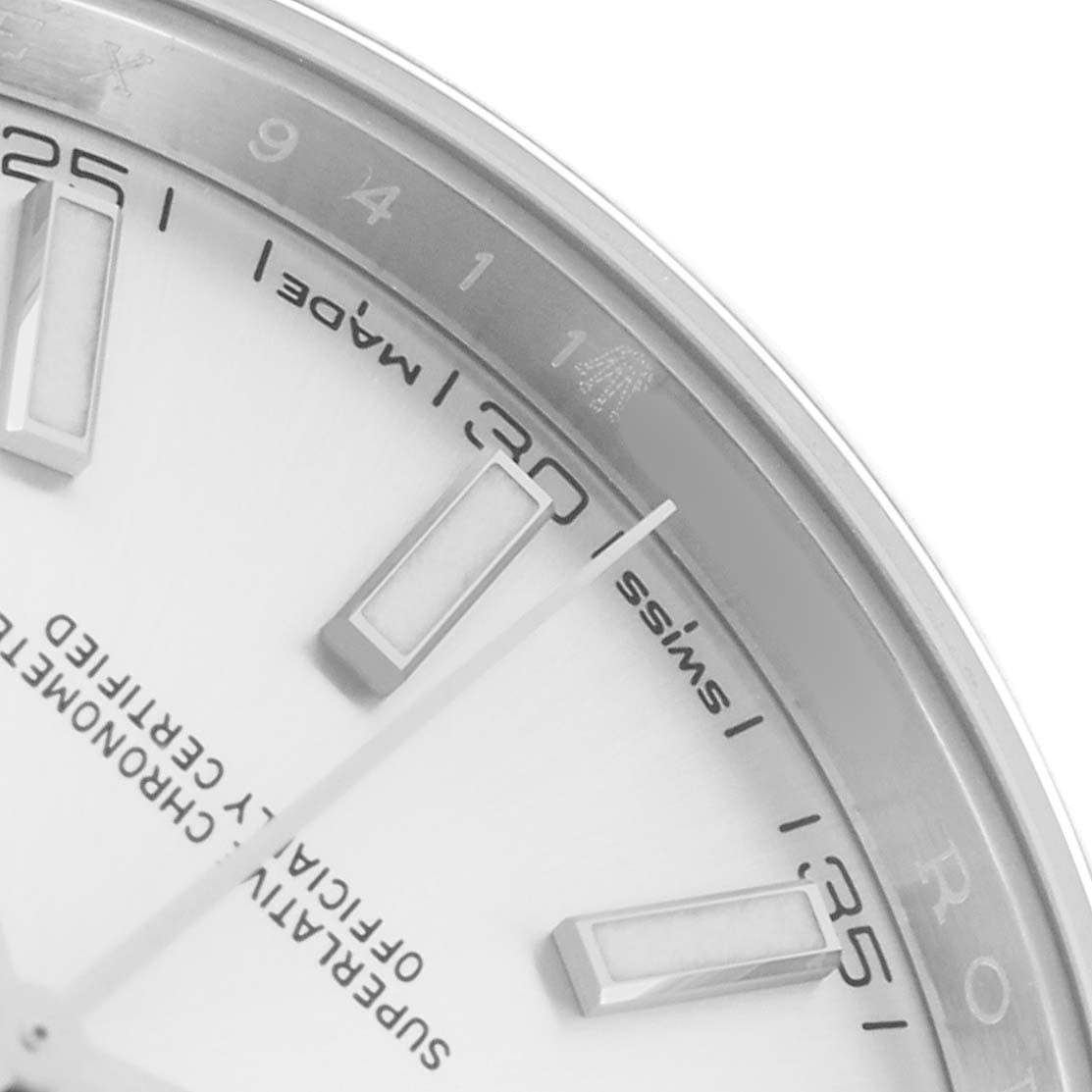 The image shows a close-up of the Rolex Datejust 126300 Men
s Stainless Steel Silver Dial watch face, focusing on the hour markers and minute details.