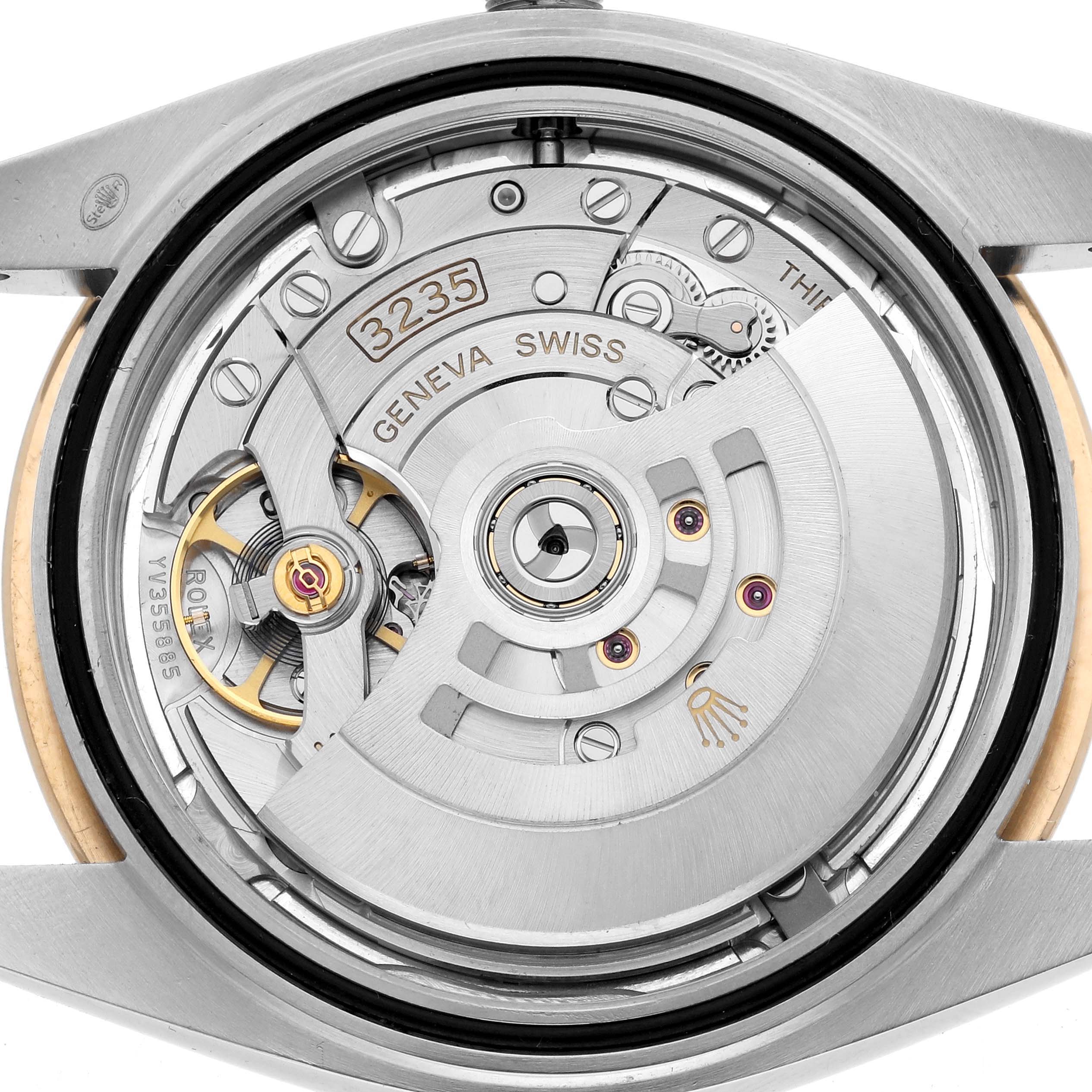 The image shows the movement of the Rolex Datejust 41 126303 Men
s Steel and Gold (two tone) Silver Dial from a rear angle, highlighting the intricate mechanical components.