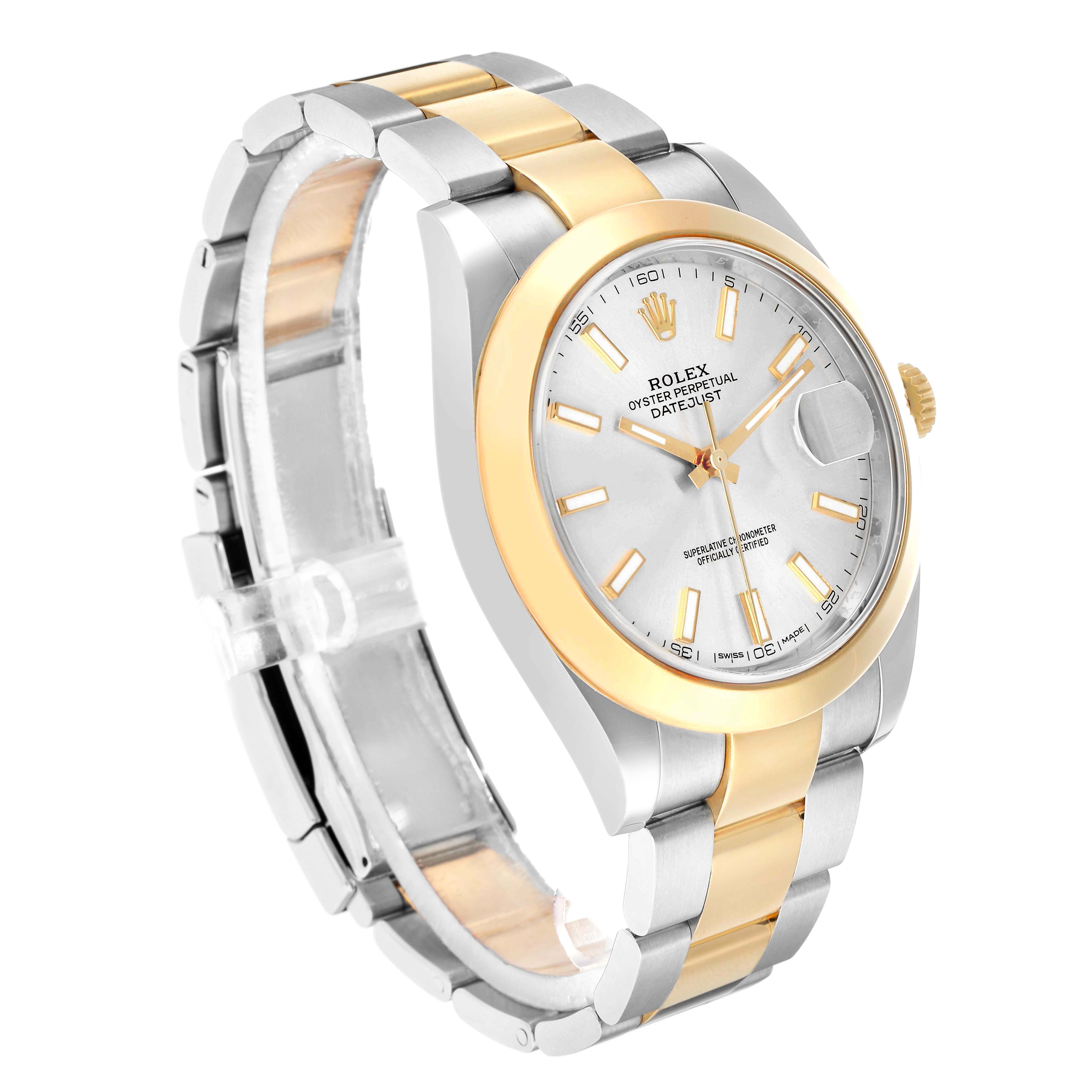 The Rolex Datejust 41 126303 Men
s Steel and Gold (two tone) Silver Dial is shown at a three-quarter angle, highlighting its oyster case, jubilee bracelet, and gold fluted bezel.