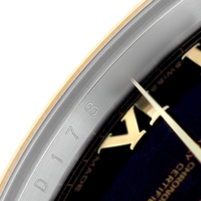 The image shows a close-up of the bezel and part of the dial with Roman numerals of a Rolex Datejust 41 116333 Men's Steel and Gold (two tone) Black Dial.