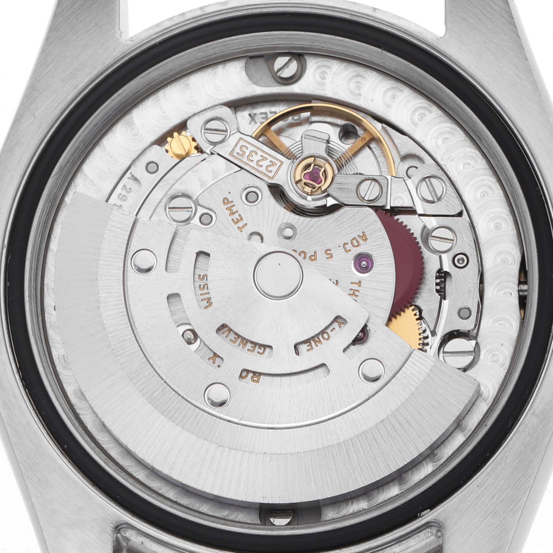 The image shows the internal mechanism of a Rolex Mid-Size 178384 Women
s Stainless Steel Brown Dial watch from the back, highlighting the rotor, gears, and jewels.