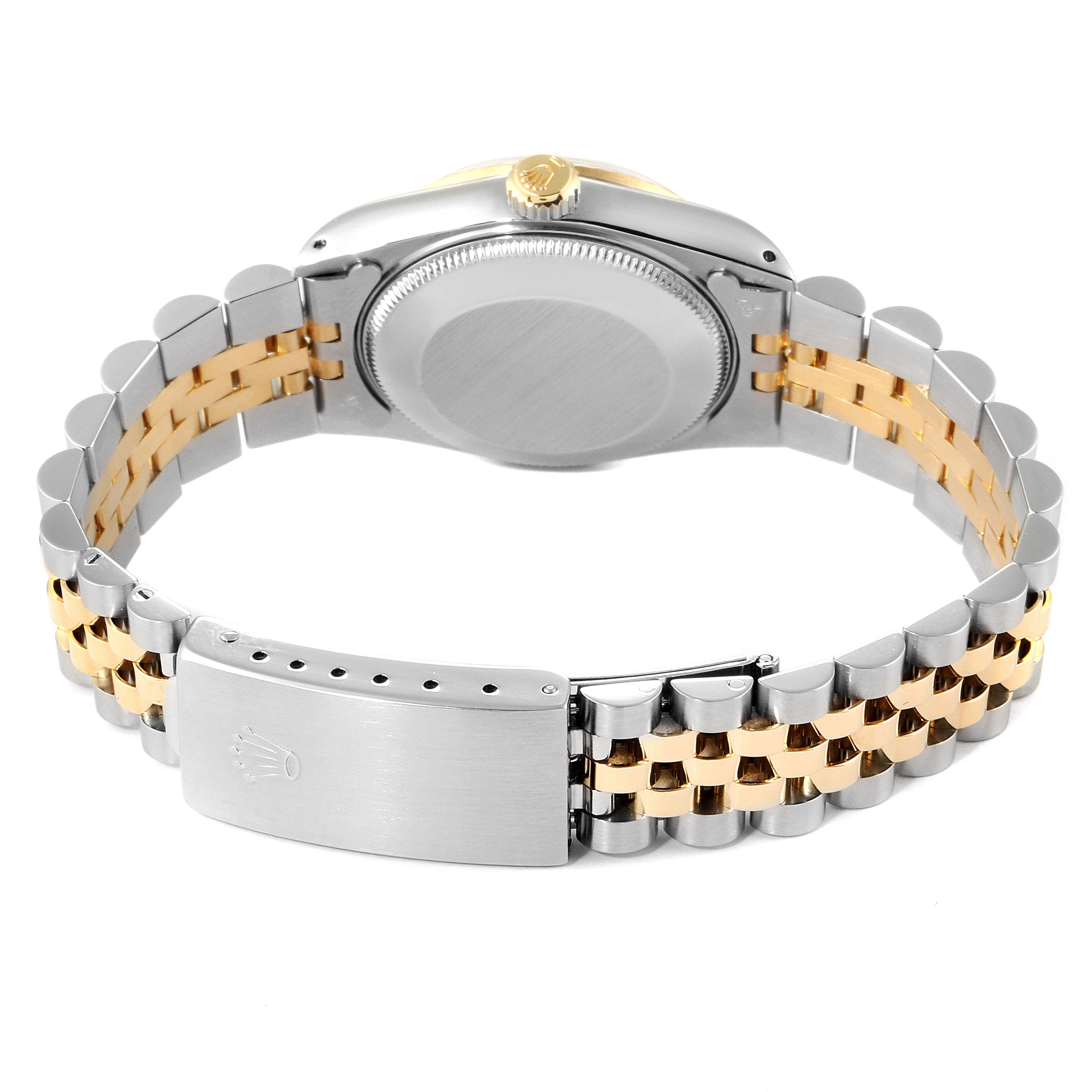 The image shows the backside and bracelet of a Mid-Size Rolex watch, highlighting the clasp and case back.