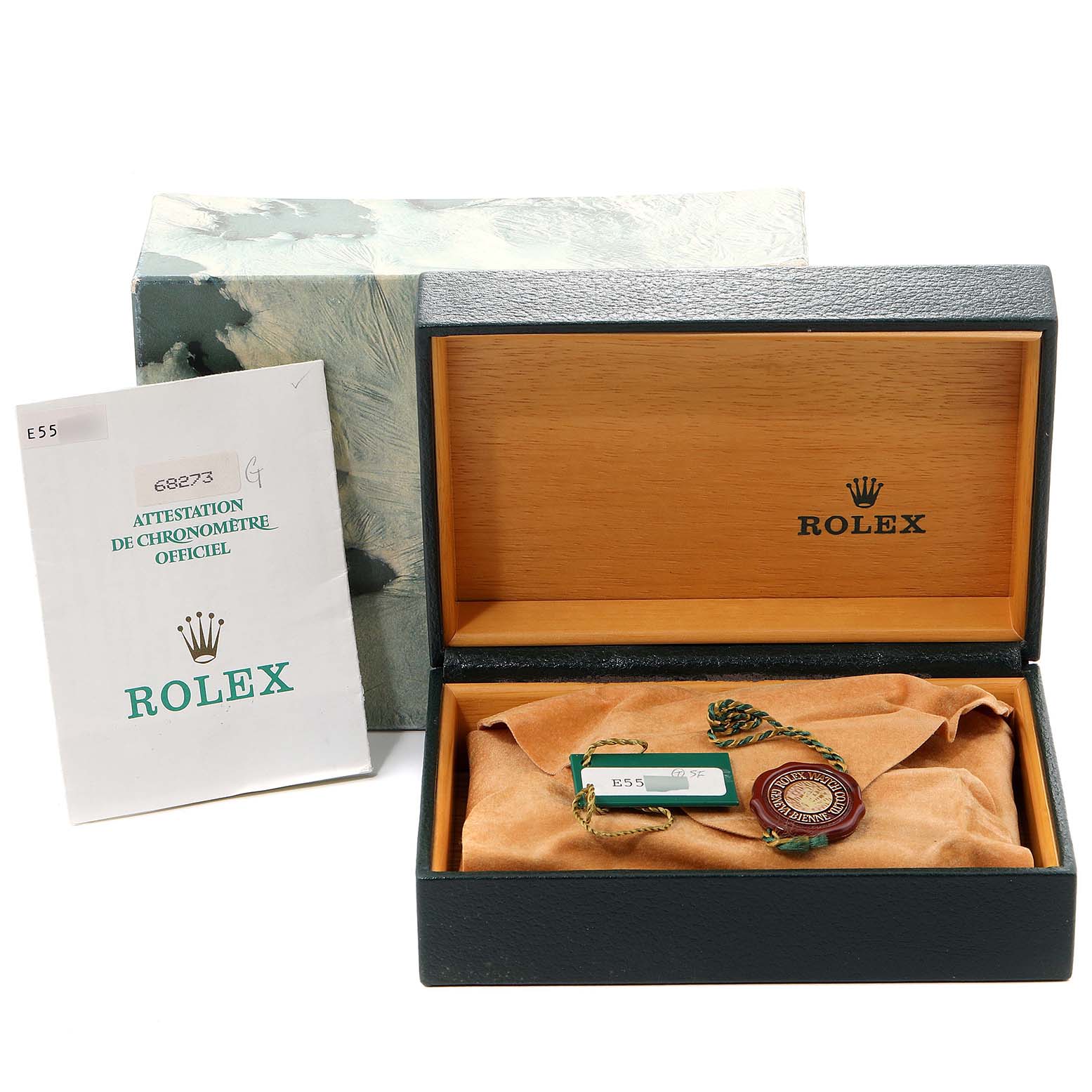 This image shows a Rolex Mid-Size 68273 Women
s Steel and Gold (two tone) Champagne Dial 68273 Women
s Steel and Gold (two tone) Champagne Dial model watch box with its certificate and tags at a straight-on angle.