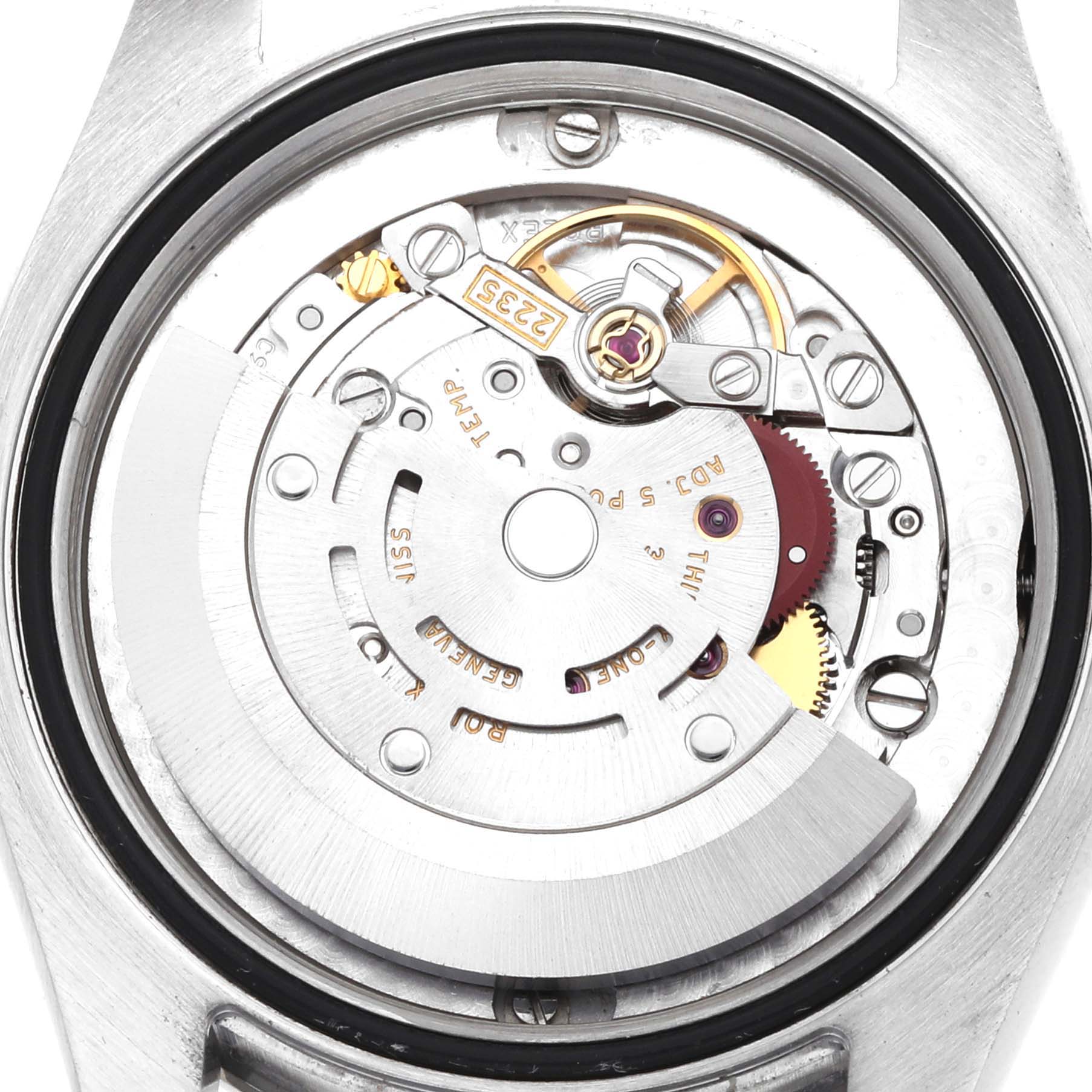 The image shows the movement mechanism of a Rolex Mid-Size 178344 Women
s Stainless Steel Blue Dial watch from a top-down angle, revealing gears and components.