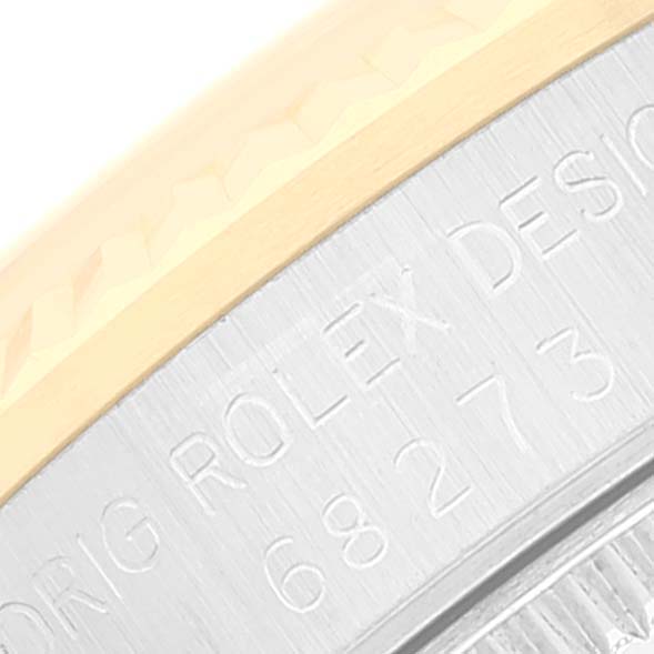 The image shows a close-up of the bezel and engraved case back of a Mid-Size Rolex watch.