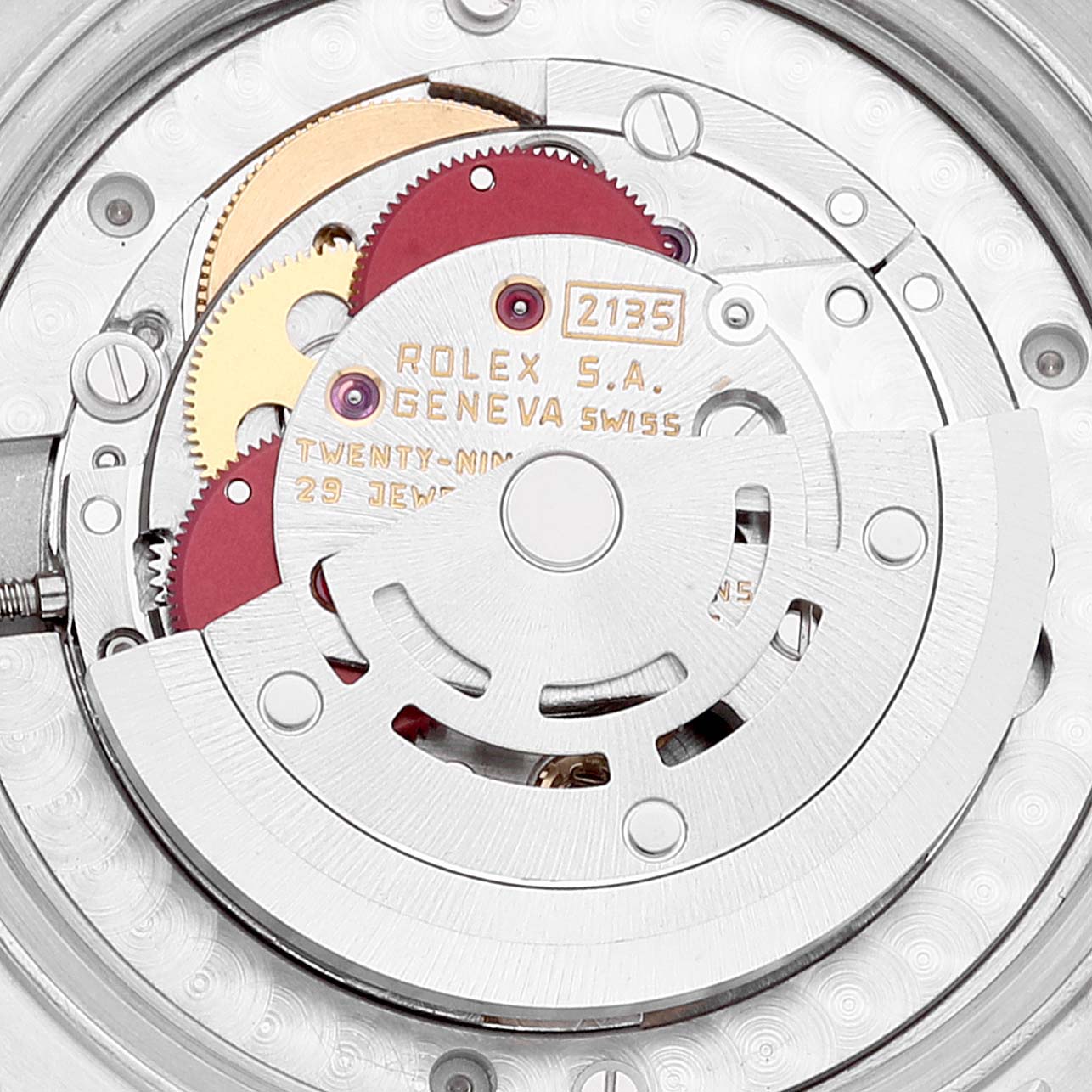 This image shows the intricate movement and gears of a Rolex Mid-Size 68273 Women's Steel and Gold (two tone) Blue Dial 68273 Women's Steel and Gold (two tone) Blue Dial watch model 2135 from a rear angle, highlighting the internal components.