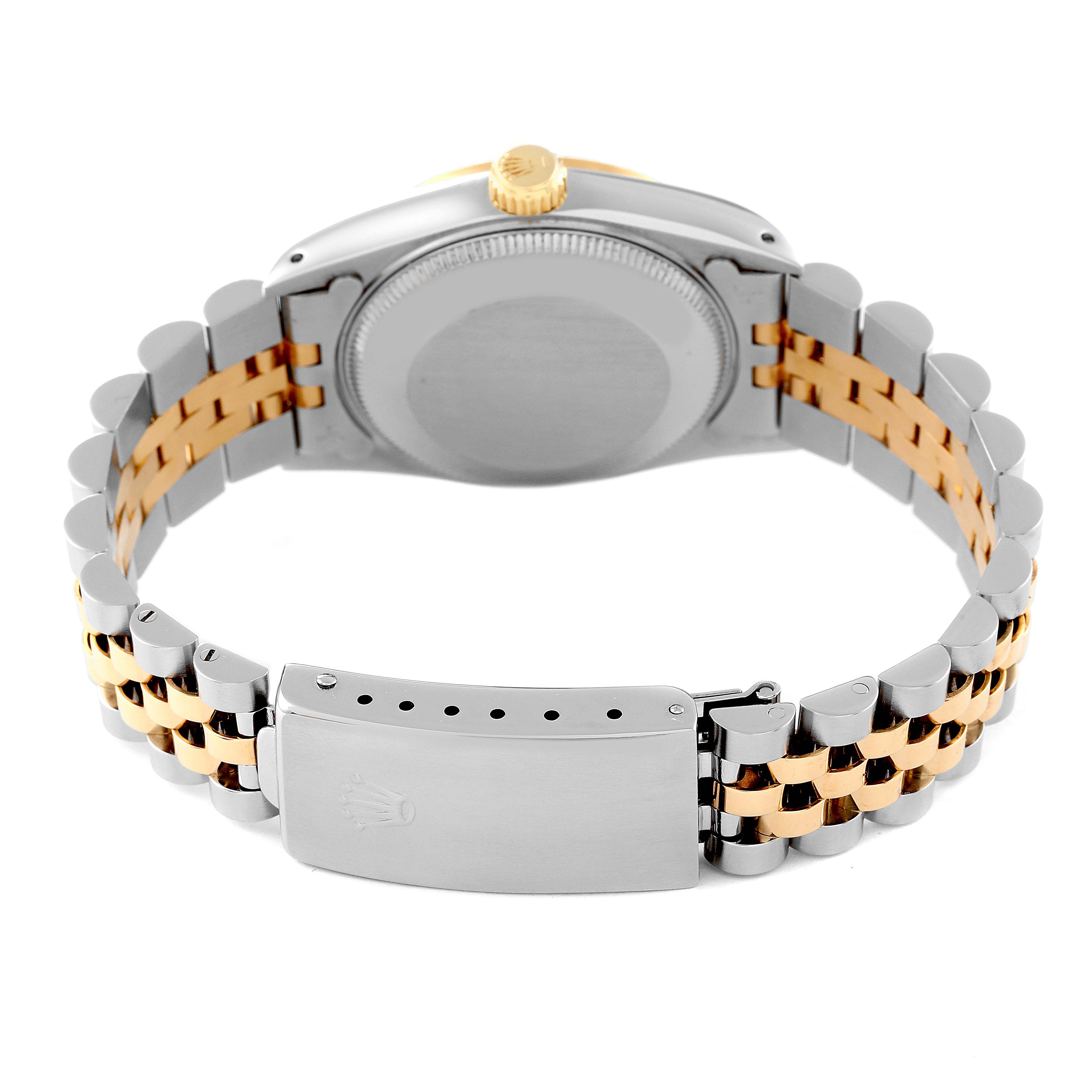 The image shows the back view of a Mid-Size Rolex watch, focusing on the case back and two-tone bracelet with the clasp visible.