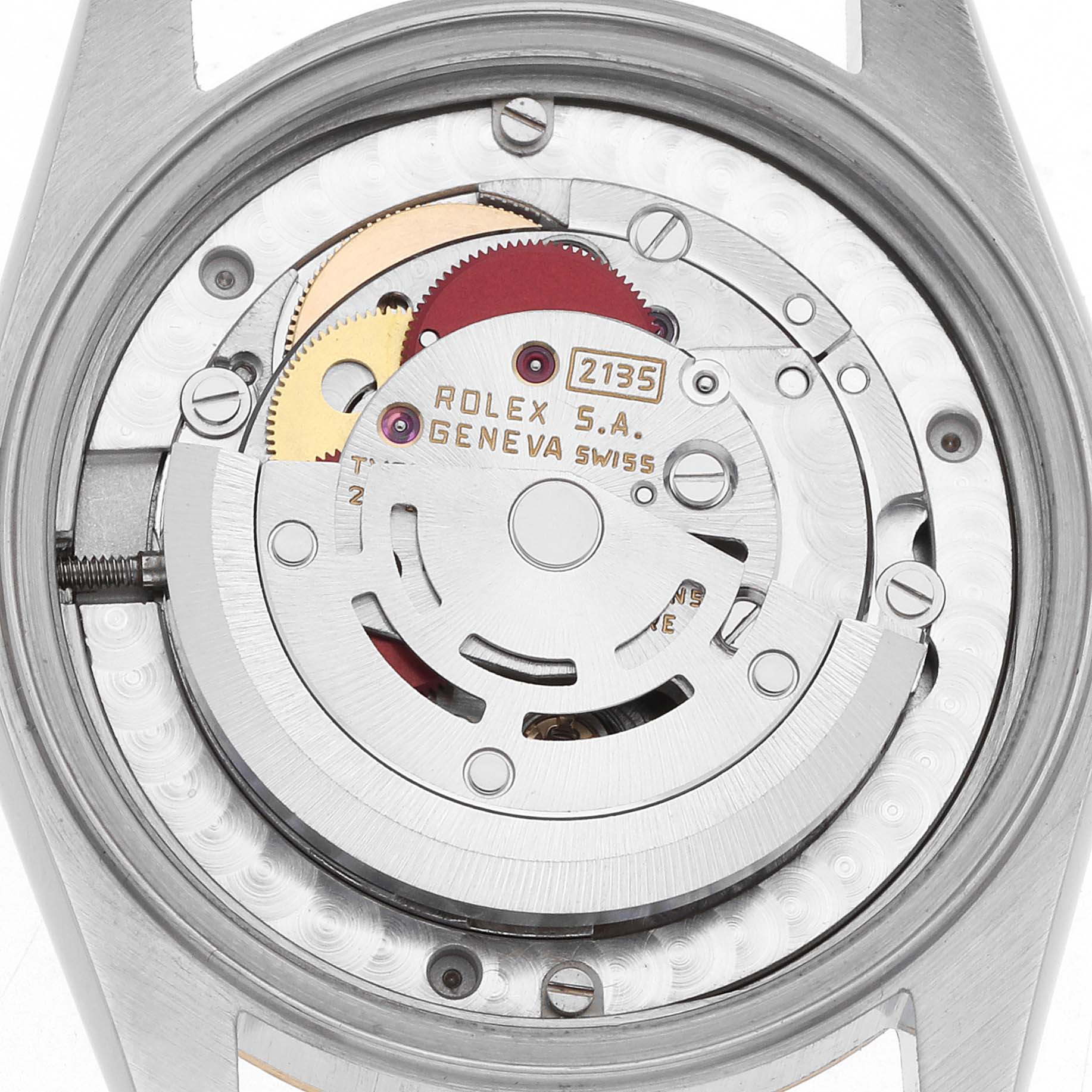 The image shows the movement of a mid-size Rolex watch, highlighting the gears and rotor from a rear angle.