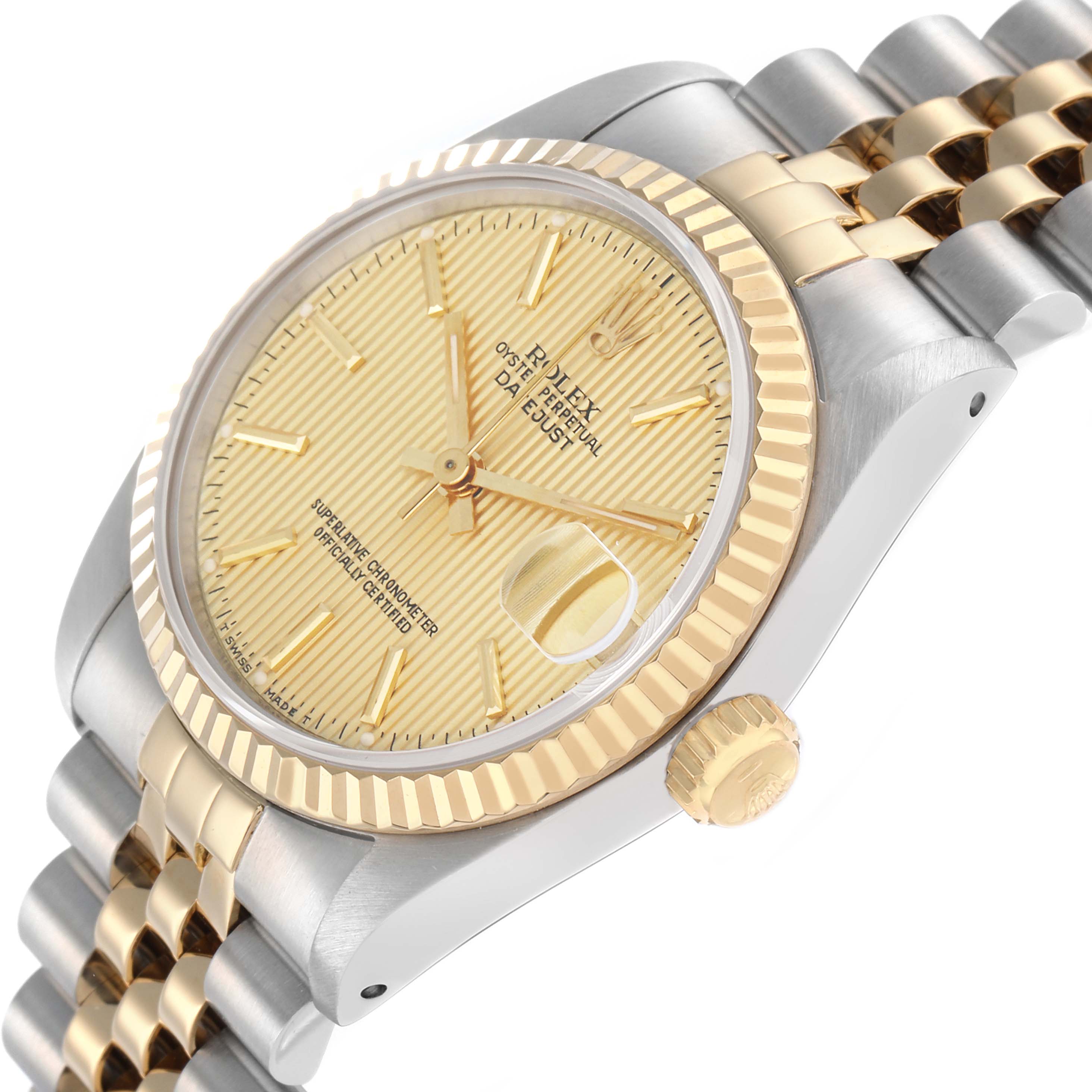 The Rolex Mid-Size 68273 Women
s Steel and Gold (two tone) Champagne Dial watch is shown at a side angle, displaying the gold and silver bracelet, fluted bezel, and champagne dial.