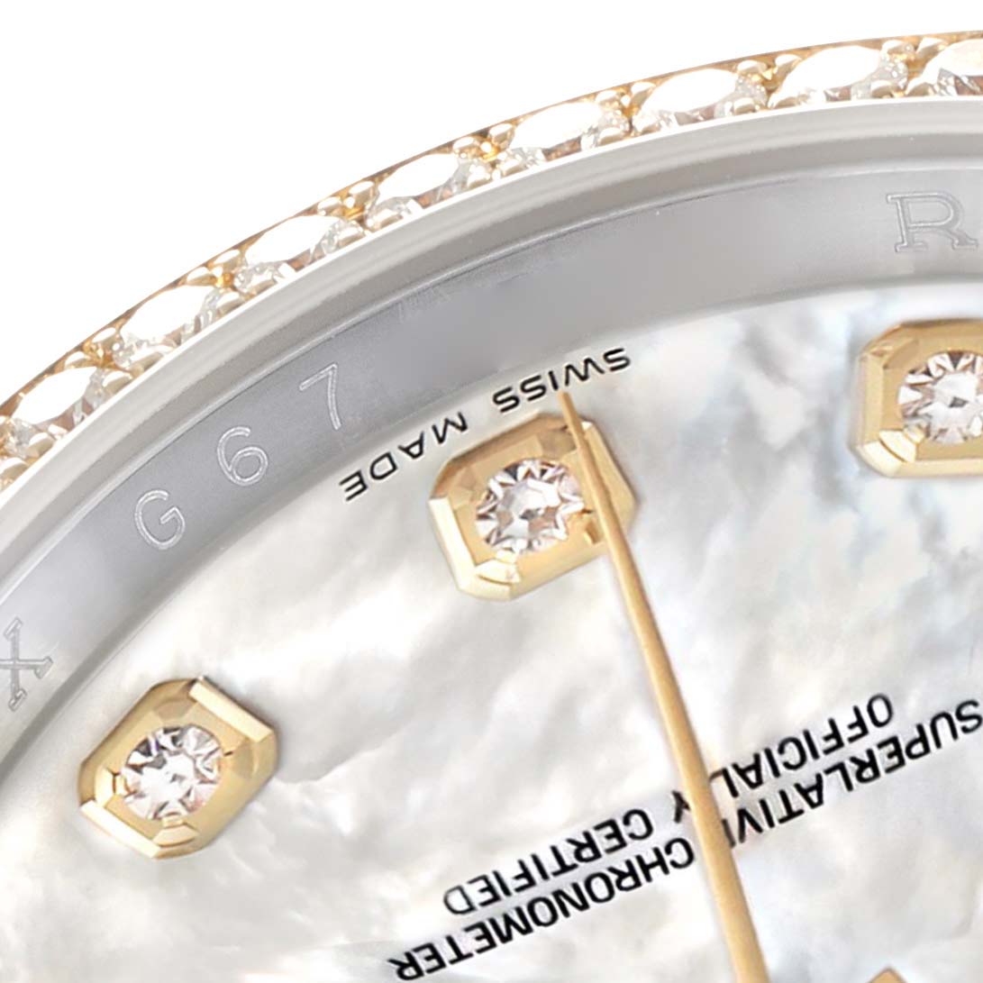 The image shows a close-up of a Rolex Datejust 116243 Men
s Steel and Gold (two tone) Mother of Pearl Dial watch, highlighting the bezel, diamond markers, and partial dial text.