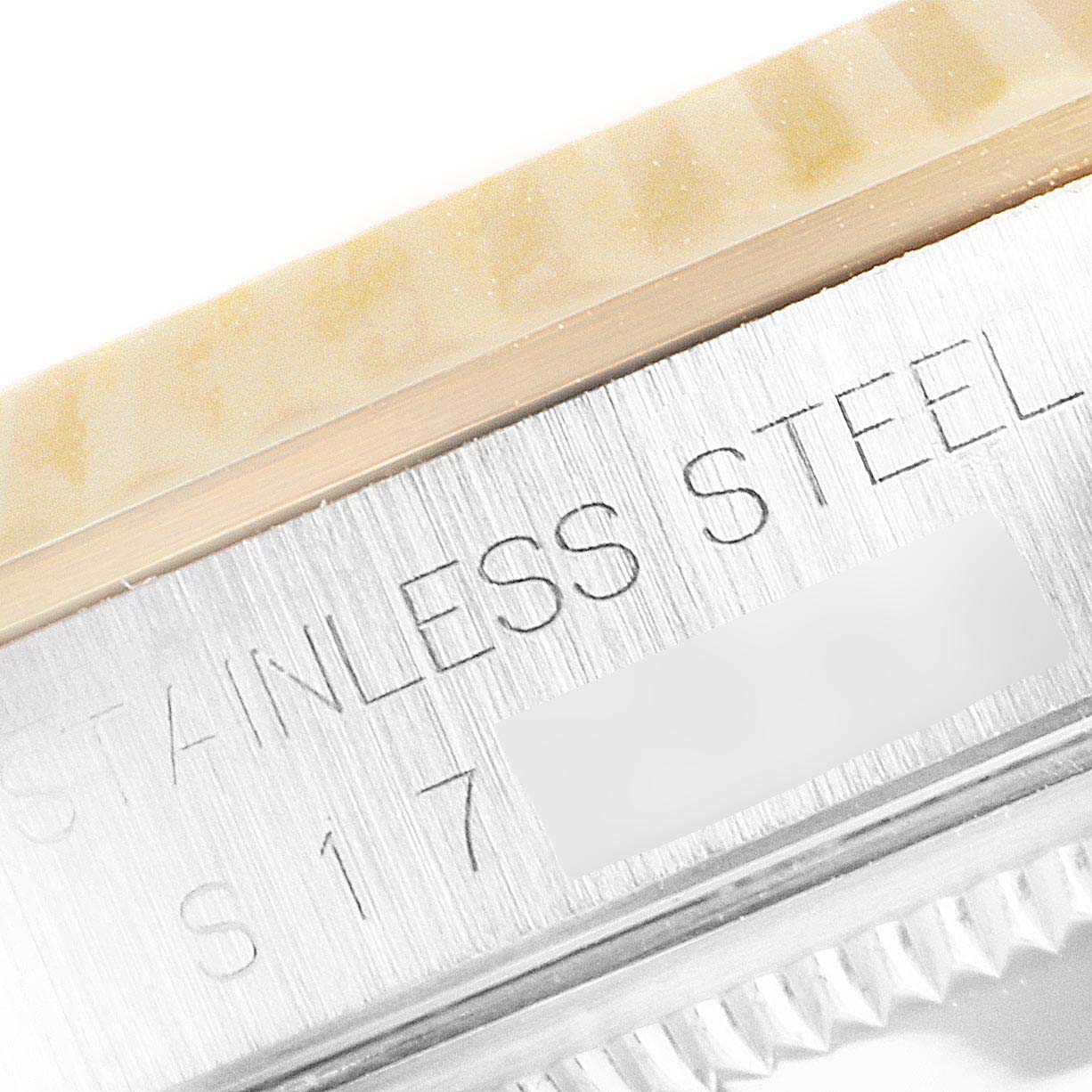 This image shows a close-up angle of the side engraving on a Rolex Datejust 16233 Men
s Steel and Gold (two tone) Champagne Dial 16233 Men
s Steel and Gold (two tone) Champagne Dial watch, highlighting "STAINLESS STEEL S17."