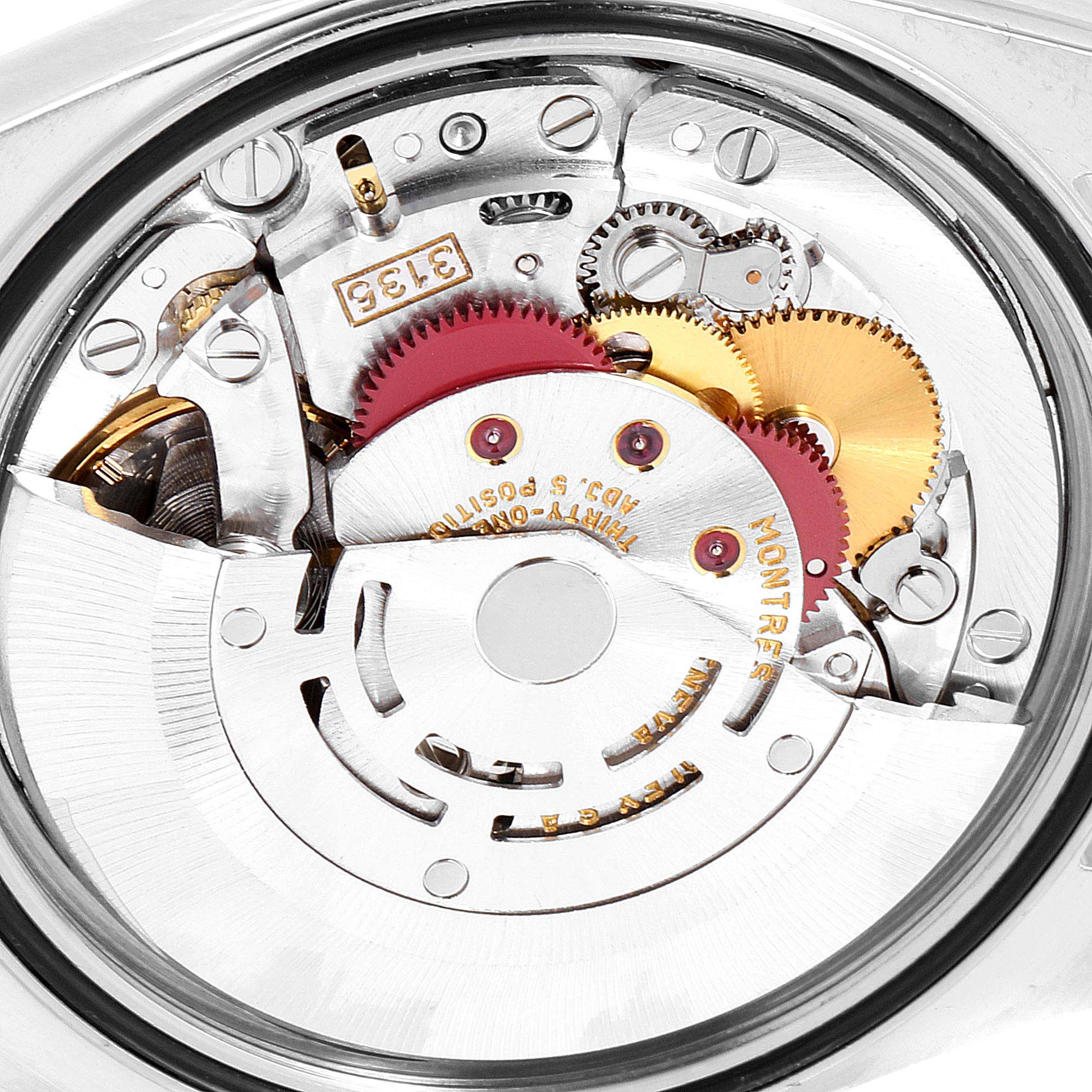 This image shows the inner mechanics and movements of a Rolex Datejust 16233 Men
s Steel and Gold (two tone) Champagne Dial 16233 Men
s Steel and Gold (two tone) Champagne Dial model watch from a bottom angle.