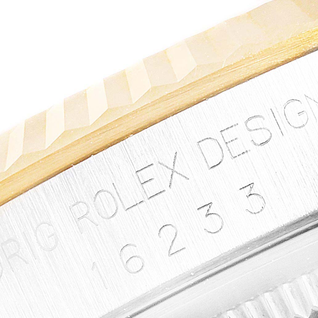 This image shows a close-up of the bezel and part of the case with engravings of the Rolex Datejust 16233 Men
s Steel and Gold (two tone) Champagne Dial 16233 Men
s Steel and Gold (two tone) Champagne Dial model.