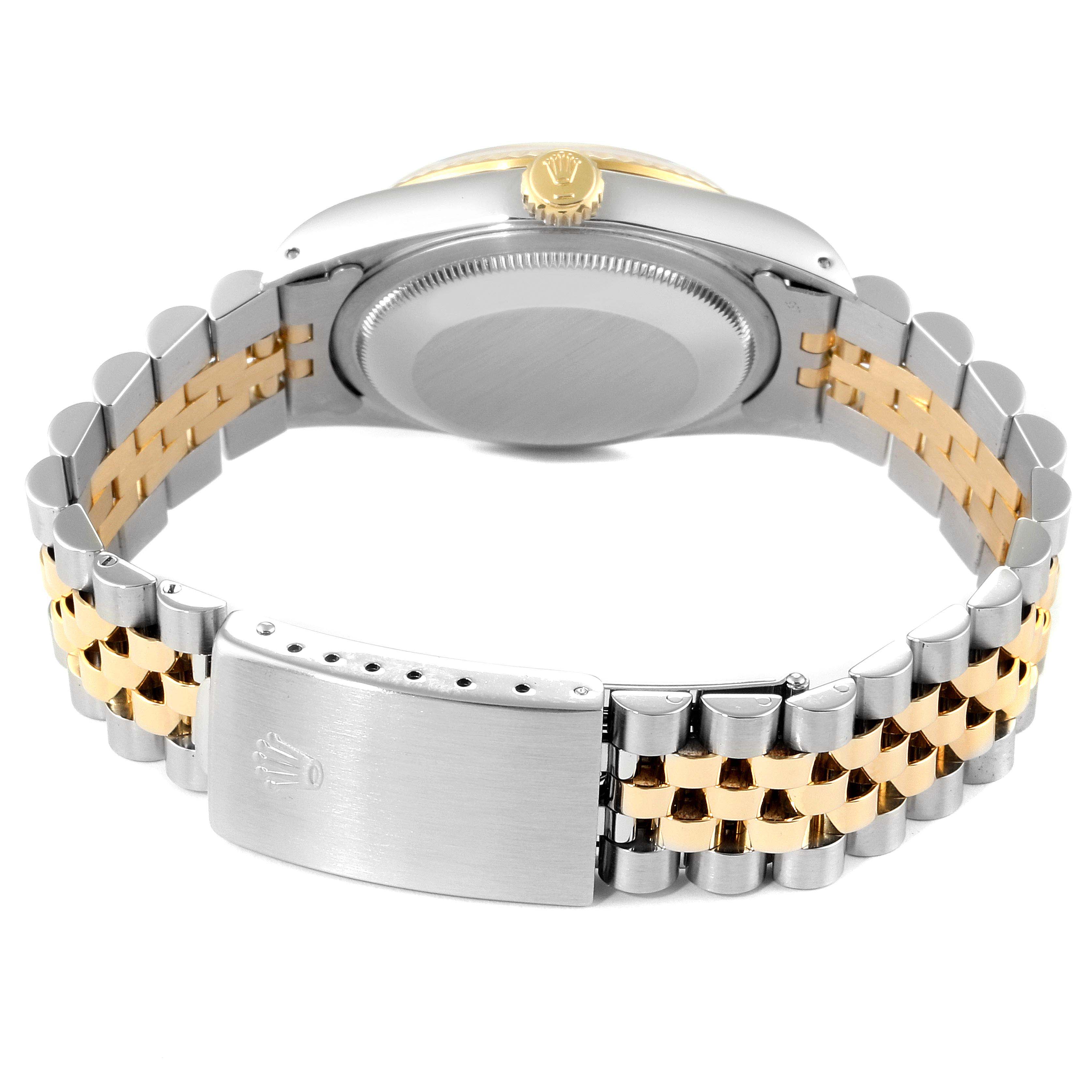 This image shows the back case and two-tone bracelet clasp of a Rolex Datejust 16233 Men
s Steel and Gold (two tone) Champagne Dial 16233 Men
s Steel and Gold (two tone) Champagne Dial watch from a rear angle.