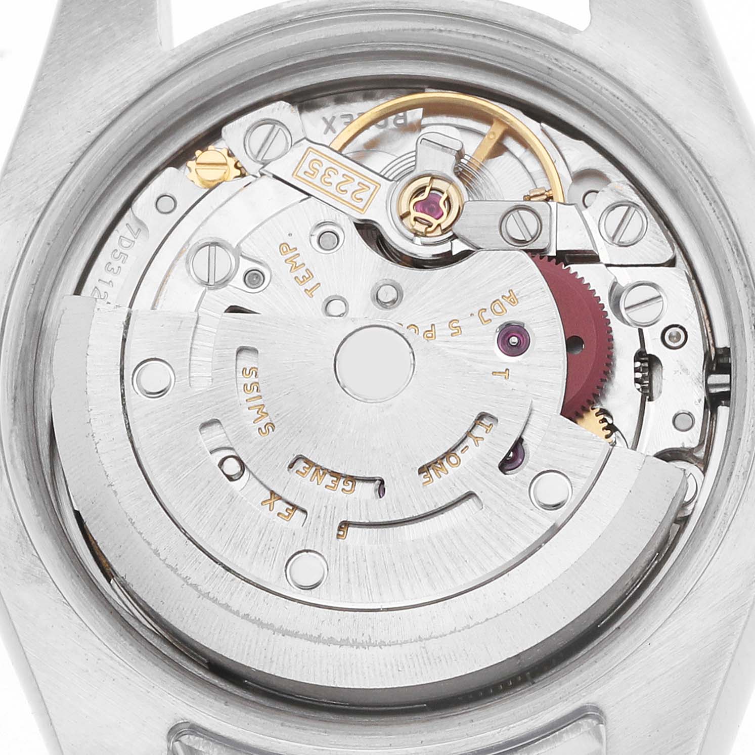 The image shows an angled view of the Rolex Datejust 179171 Women
s Steel and Gold (two tone) White Dial movement, displaying the rotor and intricate internal components.