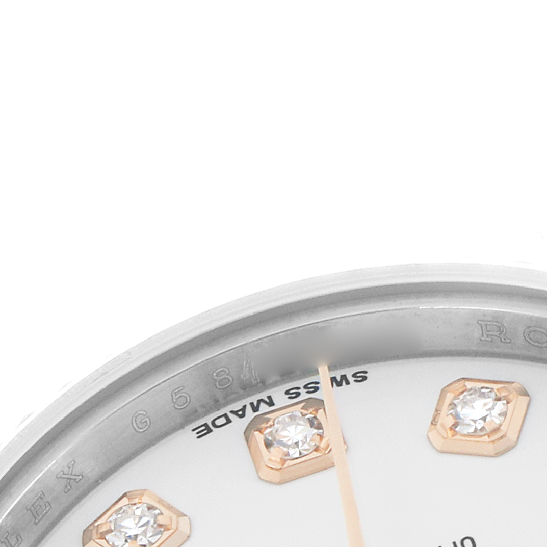 The image shows a partial view of the Rolex Datejust 179171 Women
s Steel and Gold (two tone) White Dial dial with diamond hour markers and "SWISS MADE" text at a close angle.