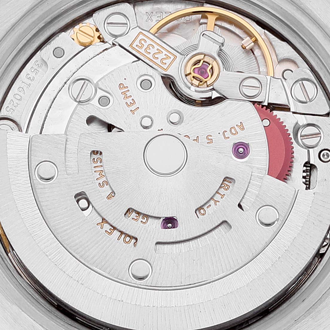 The image shows a close-up of the movement inside a Rolex Datejust 179384 Women
s Stainless Steel Mother of Pearl Dial 179384 Women
s Stainless Steel Mother of Pearl Dial watch, highlighting the intricate gears and mechanism components.