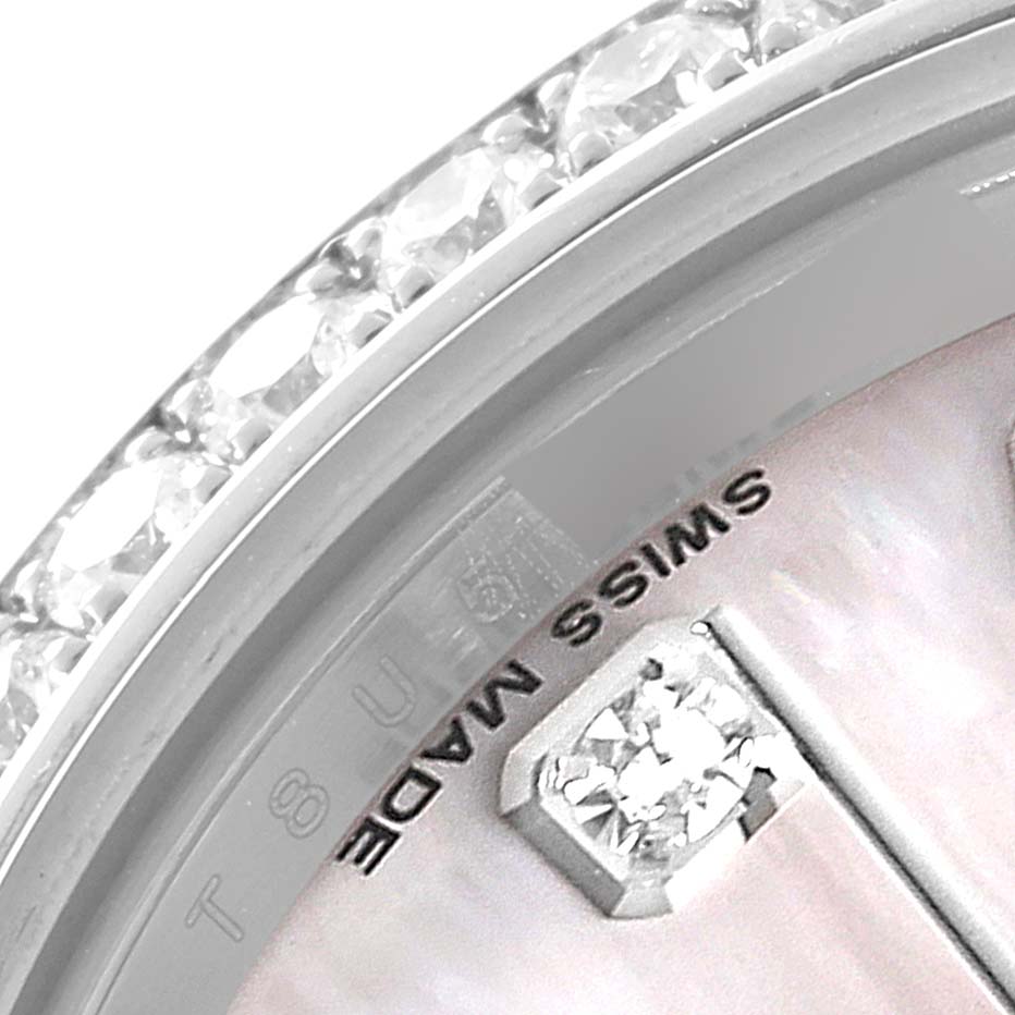The image shows a close-up of the diamond bezel and part of the dial of a Rolex Datejust 179384 Women
s Stainless Steel Mother of Pearl Dial 179384 Women
s Stainless Steel Mother of Pearl Dial watch.