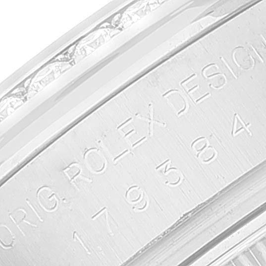 This image shows an engraved "ROLEX" hallmark on the casing of a Rolex Datejust 179384 Women
s Stainless Steel Mother of Pearl Dial 179384 Women
s Stainless Steel Mother of Pearl Dial watch.