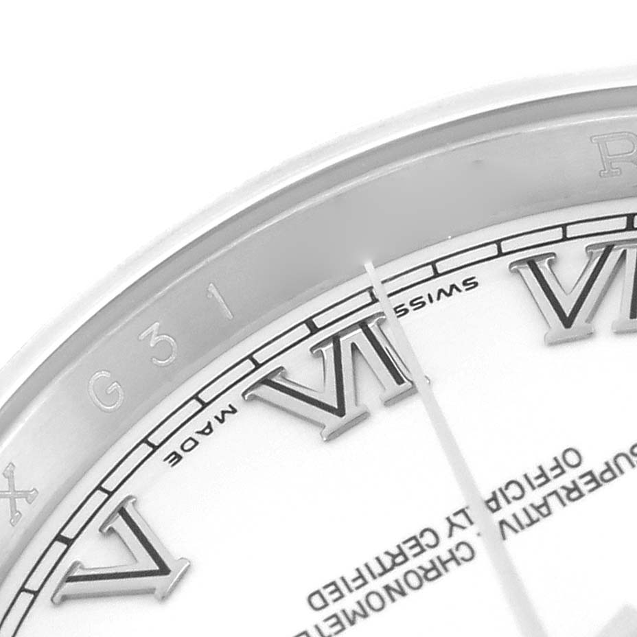The image shows a close-up angle of the Rolex Datejust 116200 Men
s Stainless Steel White Dial dial with Roman numerals and partial bezel.