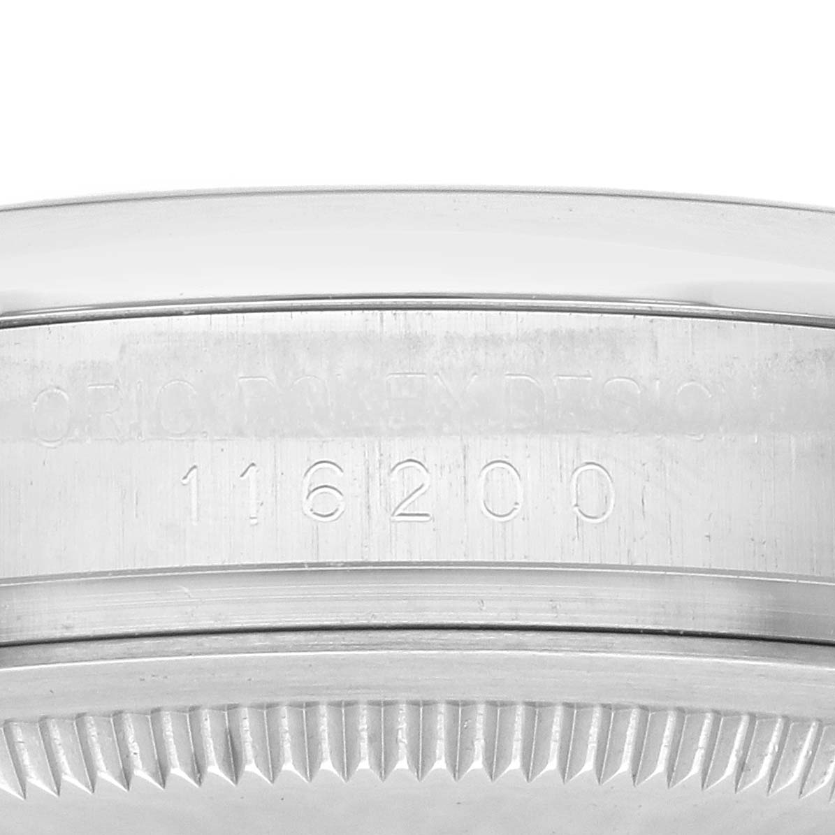 The image shows the side of a Rolex Datejust 116200 Men
s Stainless Steel White Dial case focusing on its engraved reference number.