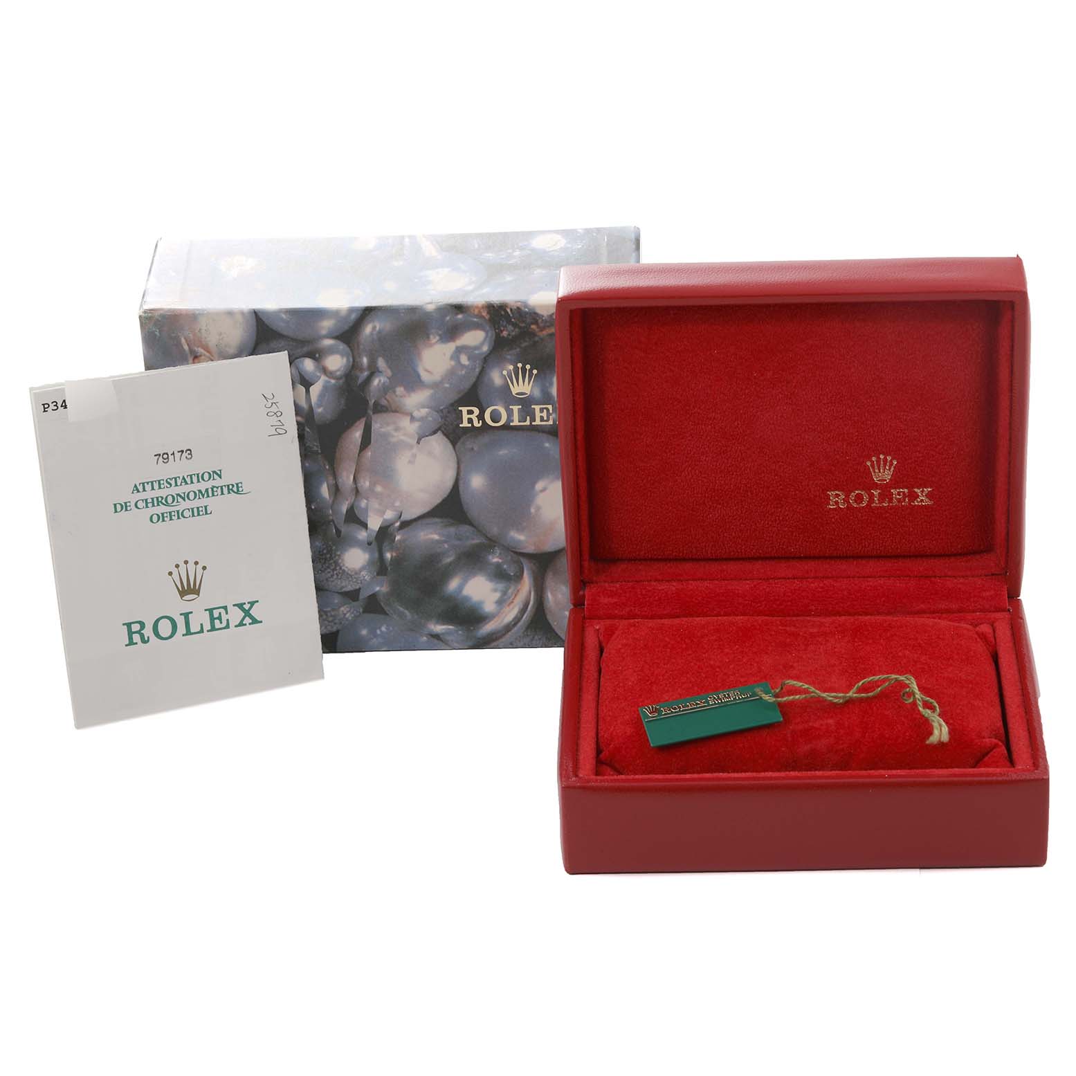 The image shows the packaging and accessories for a Rolex Datejust 79173 Women's Steel and Gold (two tone) Champagne Dial 79173 Women's Steel and Gold (two tone) Champagne Dial, including the box, booklet, and tag.
