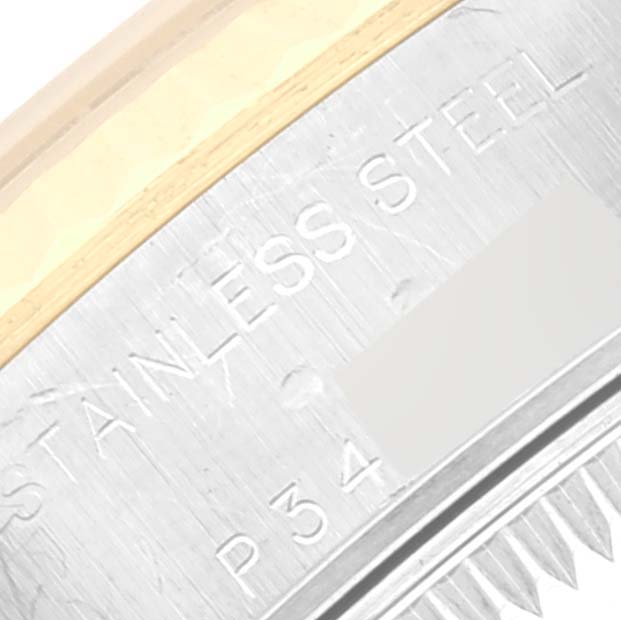 This image shows a close-up of the stainless steel casing and part of the bezel for a Rolex Datejust 79173 Women's Steel and Gold (two tone) Champagne Dial 79173 Women's Steel and Gold (two tone) Champagne Dial watch.