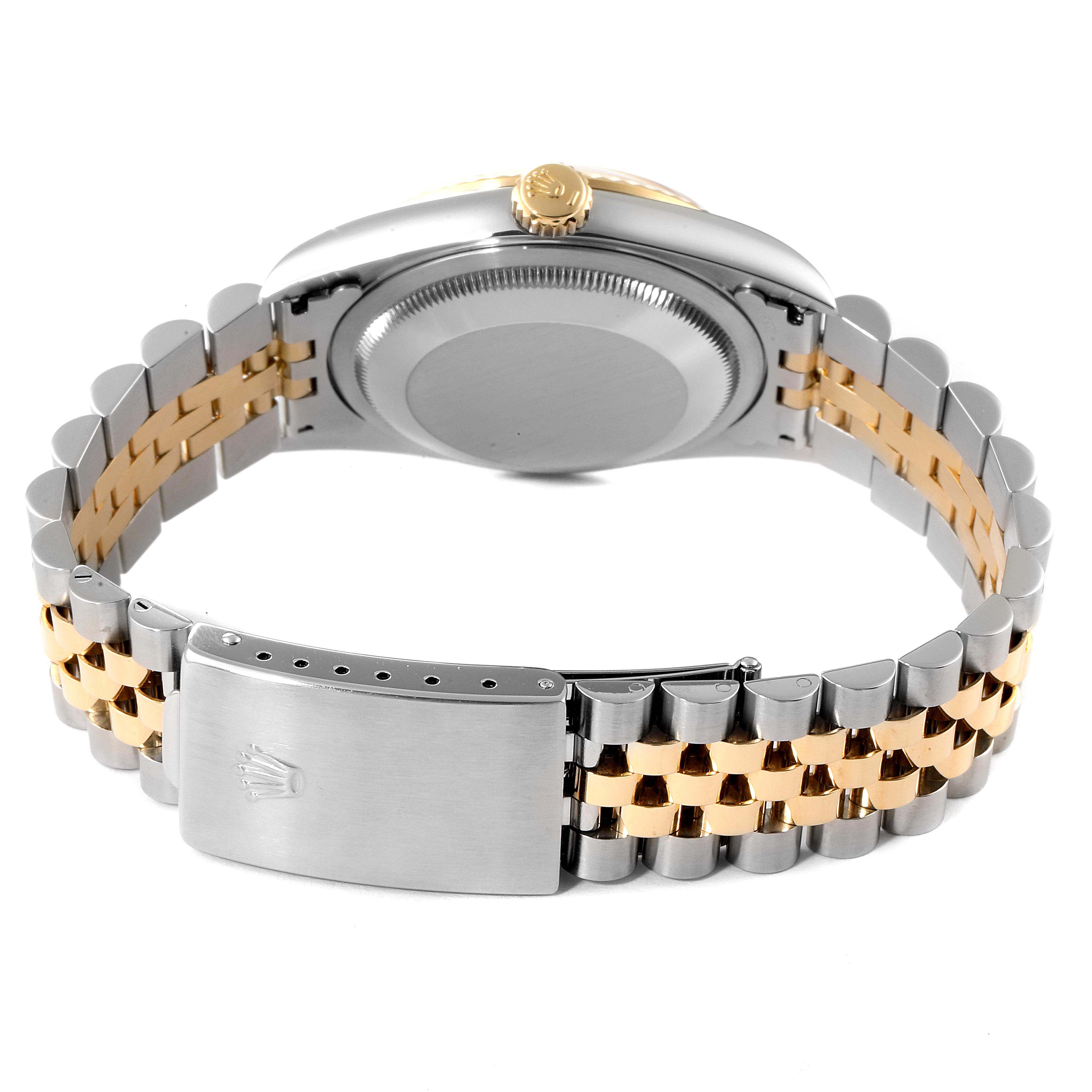 The image shows the back of a Rolex Datejust 16233 Men's Steel and Gold (two tone) Champagne Dial 16233 Men's Steel and Gold (two tone) Champagne Dial watch, highlighting the case, crown, and Jubilee bracelet with a clasp.