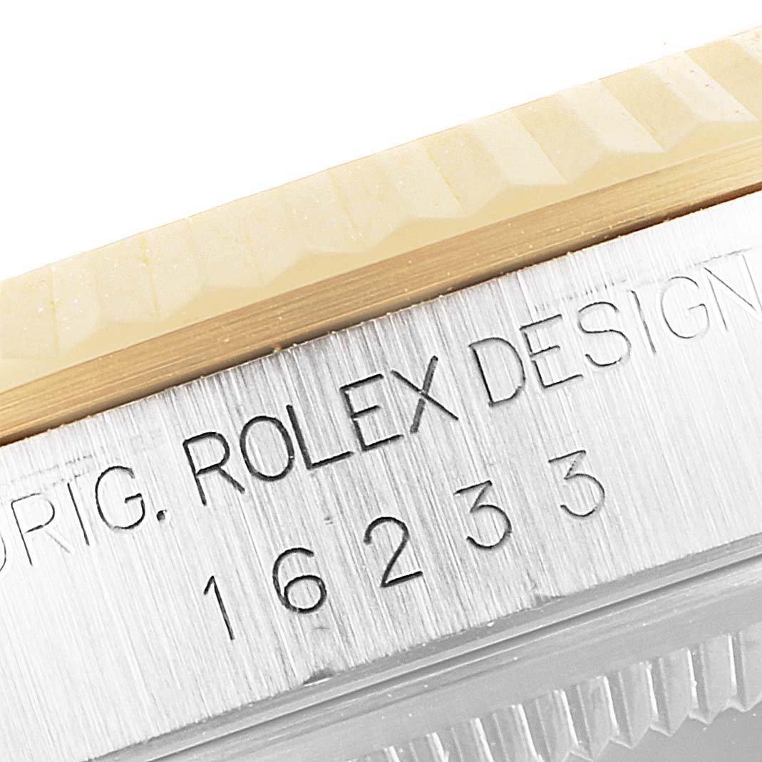 The image shows a close-up of the model number engraving on the case edge of a Rolex Datejust 16233 Men's Steel and Gold (two tone) Champagne Dial 16233 Men's Steel and Gold (two tone) Champagne Dial watch.