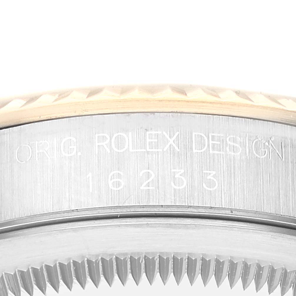 This is a close-up of the casing side of the Rolex Datejust 16233 Men's Steel and Gold (two tone) White Dial 16233 Men's Steel and Gold (two tone) White Dial watch, showing the model number and part of the bezel.