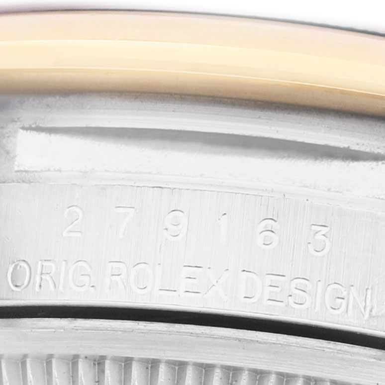 The image shows a close-up of the edge and engraving on the case of a Rolex Datejust 279163 Women's Steel and Gold (two tone) Green Dial watch.