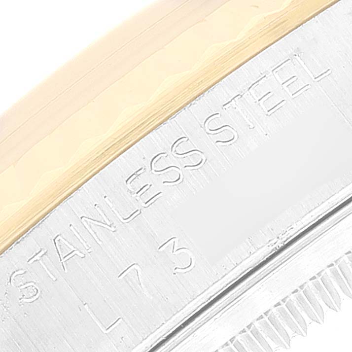 The image shows a close-up of the stainless steel part with partial inscriptions on a Rolex Datejust 16233 Men's Steel and Gold (two tone) Beige Dial 16233 Men's Steel and Gold (two tone) Beige Dial watch.