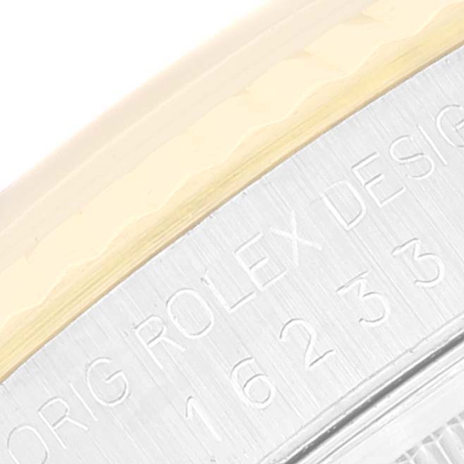 The image shows an angled close-up of the bezel and case side of a Rolex Datejust 16233 Men's Steel and Gold (two tone) Beige Dial 16233 Men's Steel and Gold (two tone) Beige Dial watch, with part of the model number engraved.