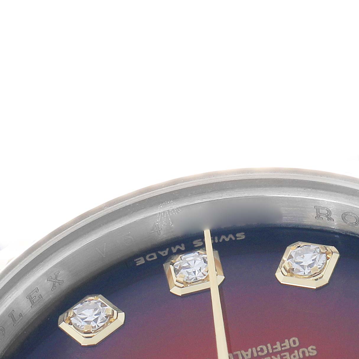 The image shows a close-up of the dial edge and bezel of the Rolex Datejust 179173 Women
s Steel and Gold (two tone) Red Dial, highlighting diamond hour markers and text.