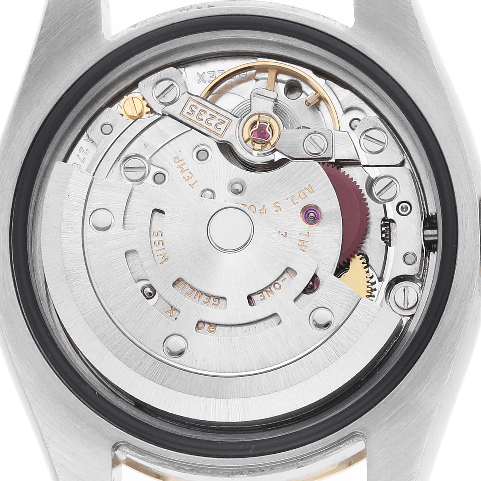 The image shows the movement of a Rolex Datejust 179173 Women
s Steel and Gold (two tone) Red Dial watch from a back view, highlighting the rotor and mechanical components.