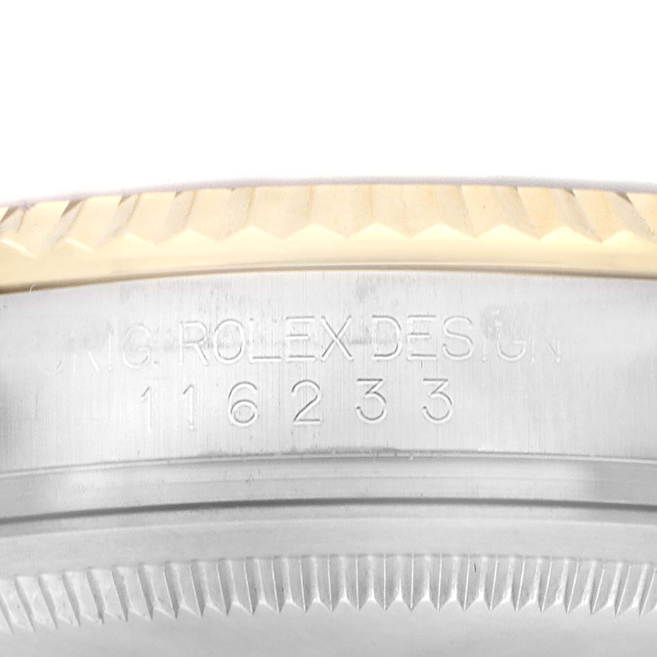 The image shows a close-up of the side of the Rolex Datejust 116233 Men
s Steel and Gold (two tone) Silver Dial bezel and case, highlighting the engraved text and model number.