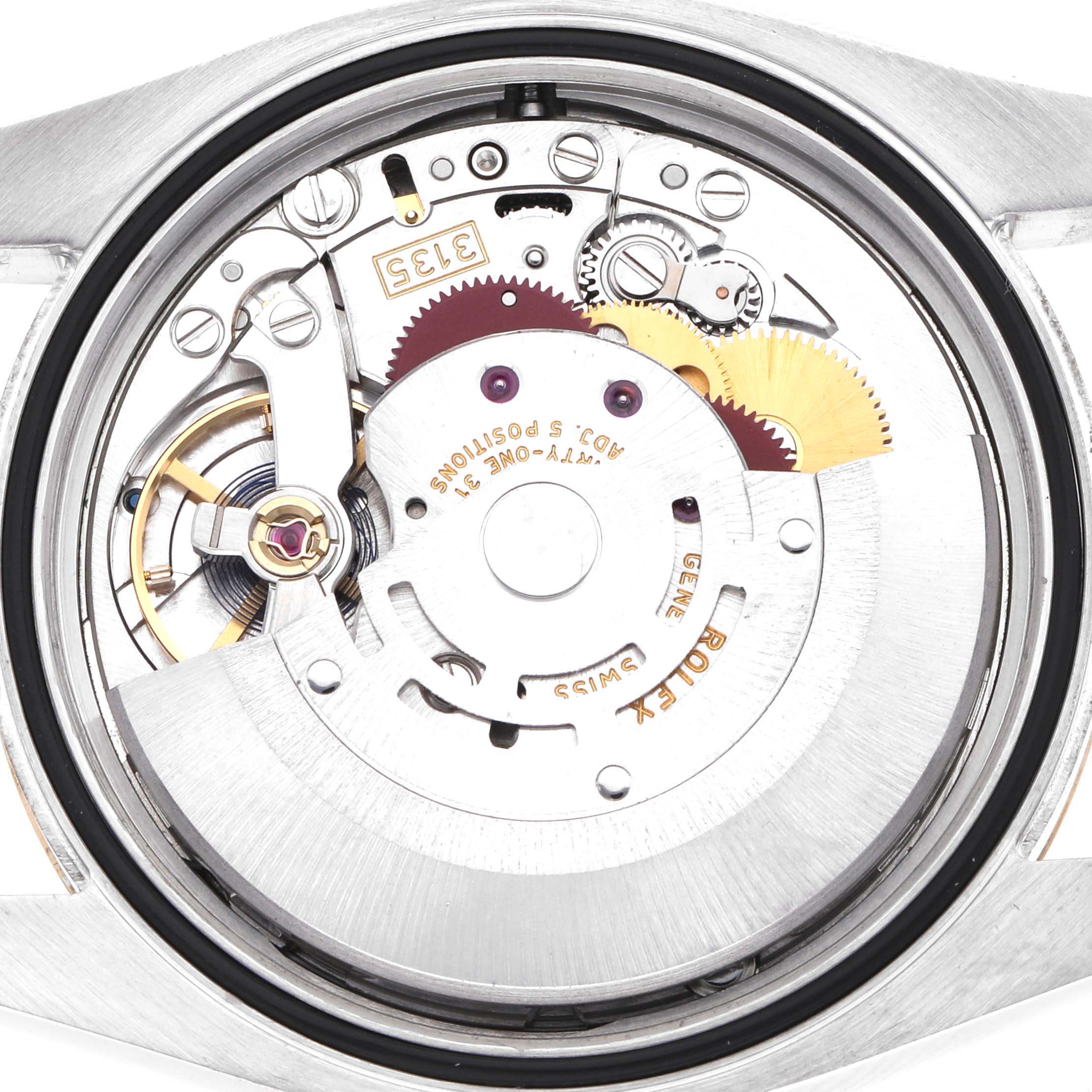 This image shows the movement of a Rolex Datejust 116233 Men
s Steel and Gold (two tone) Silver Dial watch from a top-down angle, revealing gears and components.
