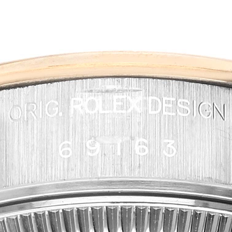 The image shows a close-up of the case side of a Rolex Datejust 69163 Women's Steel and Gold (two tone) Grey Dial 69163 Women's Steel and Gold (two tone) Grey Dial, highlighting the model number and "ROLEX DESIGN" engraving.