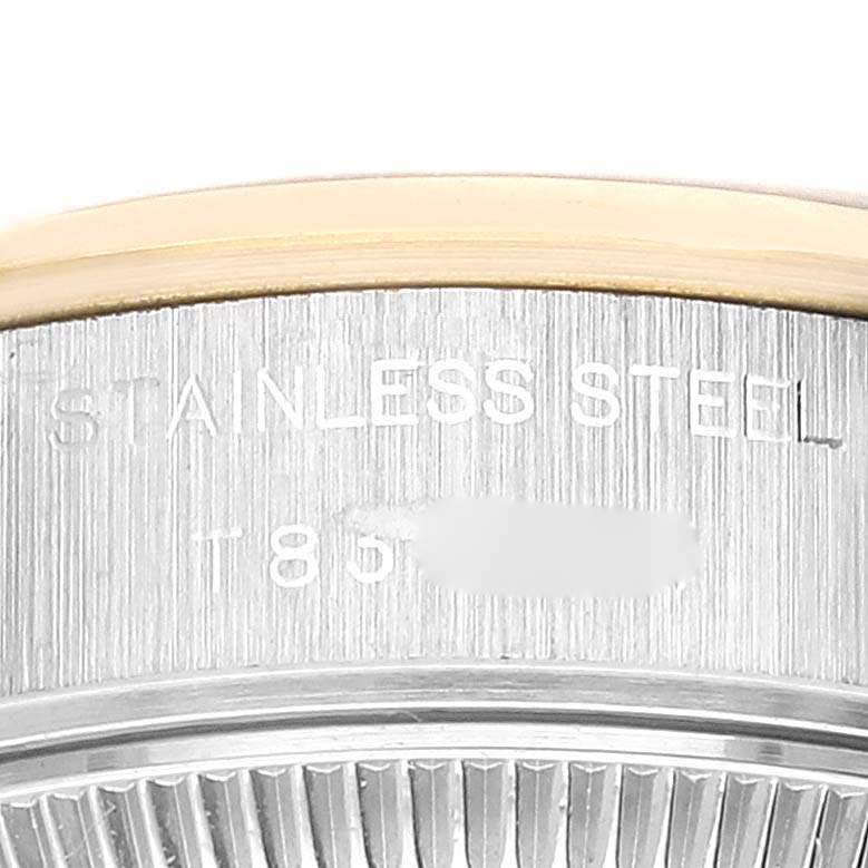 This image shows a close-up view of the stainless steel and gold bezel of a Rolex Datejust 69163 Women's Steel and Gold (two tone) Grey Dial 69163 Women's Steel and Gold (two tone) Grey Dial watch.