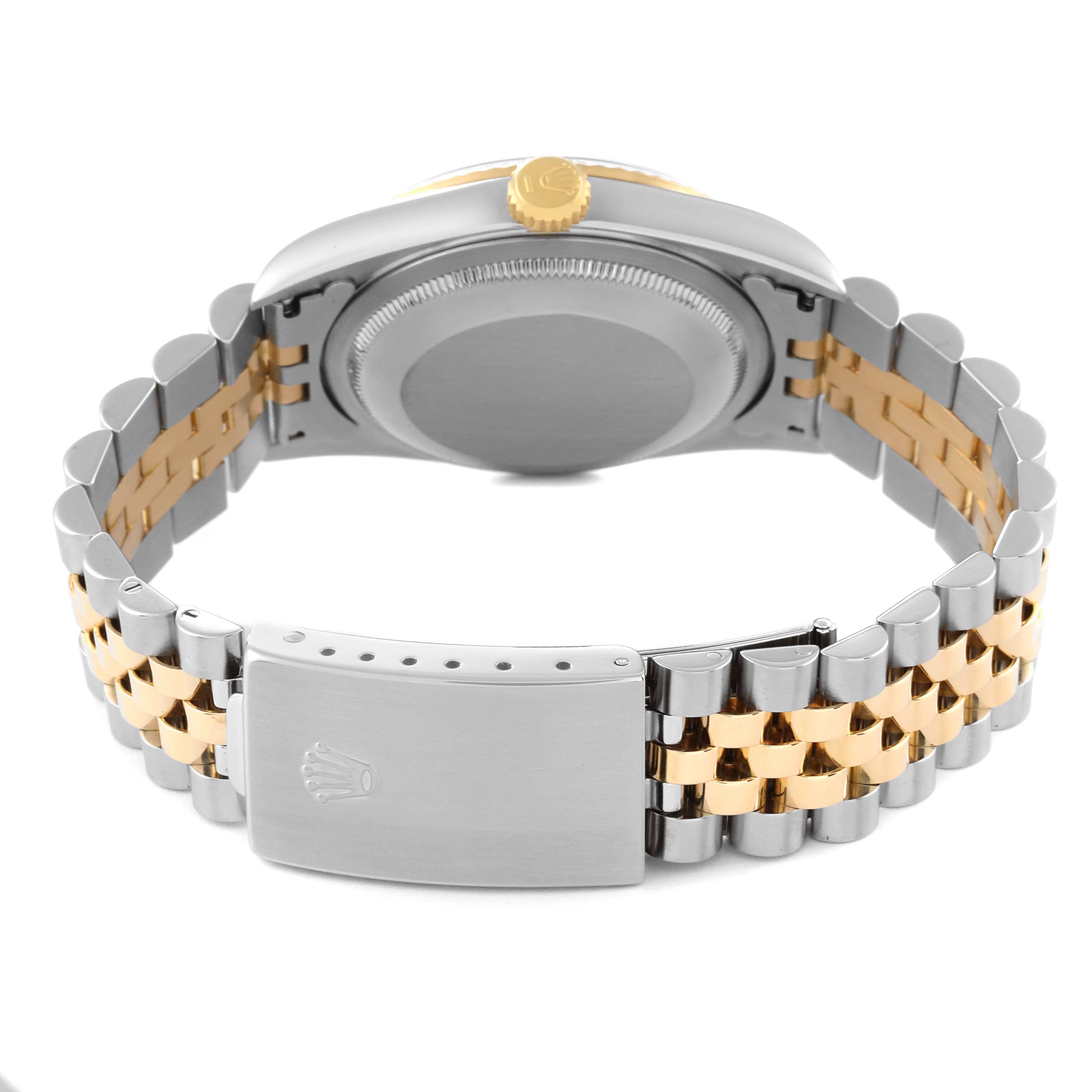 The image shows the backside of a Rolex Datejust 16233 Men's Steel and Gold (two tone) Grey Dial 16233 Men's Steel and Gold (two tone) Grey Dial watch, highlighting the case back, crown, and two-tone bracelet with a clasp.