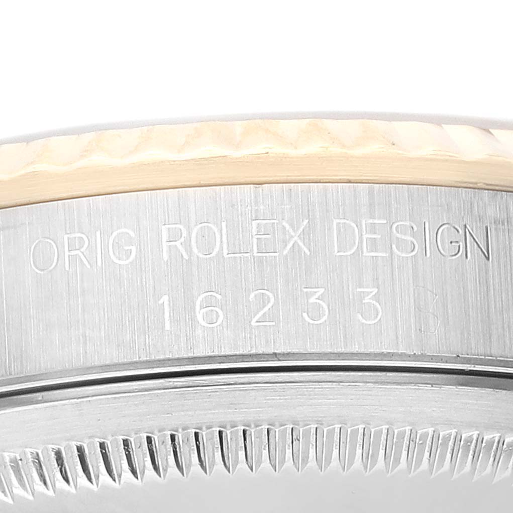 This image shows a close-up of the engraved side of the case on a Rolex Datejust 16233 Men's Steel and Gold (two tone) White Dial 16233 Men's Steel and Gold (two tone) White Dial watch.