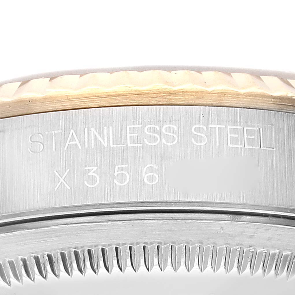 A close-up view of the case back and fluted bezel on the Rolex Datejust 16233 Men's Steel and Gold (two tone) White Dial 16233 Men's Steel and Gold (two tone) White Dial, showcasing the stainless steel engraving and reference number.