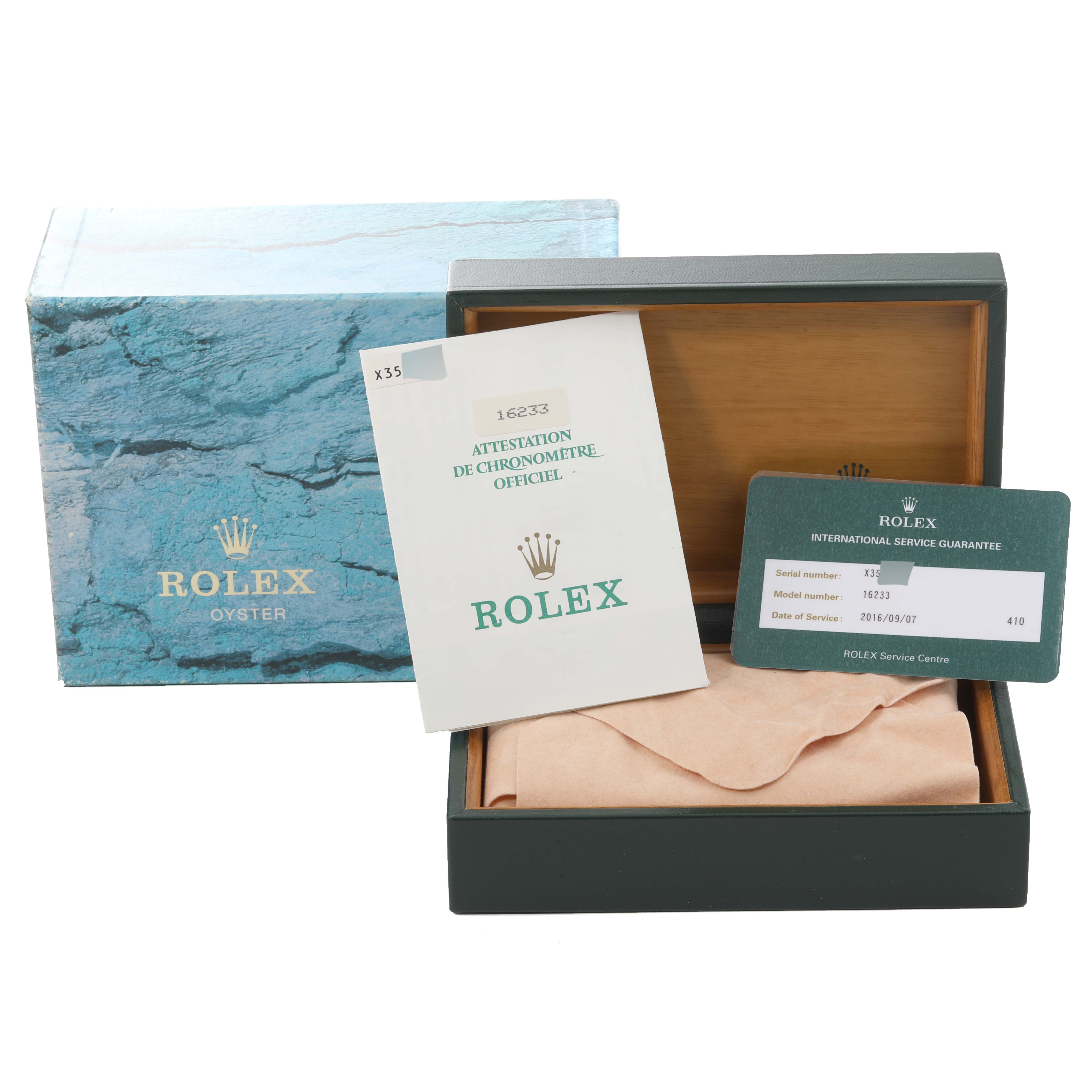 The image shows the packaging and documentation of a Rolex Datejust 16233 Men's Steel and Gold (two tone) White Dial 16233 Men's Steel and Gold (two tone) White Dial watch, including the box, manual, and service guarantee card.