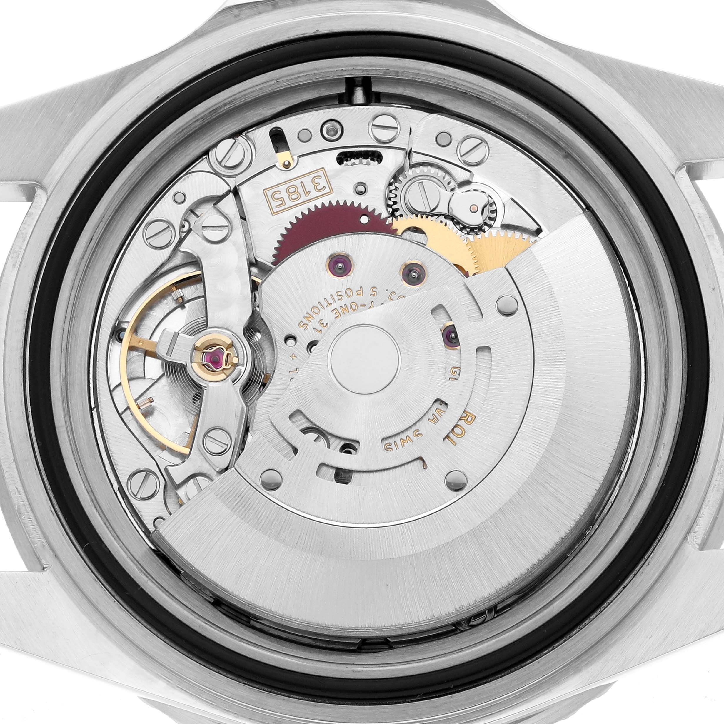 The image shows the movement of a Rolex GMT-Master 16710 Men
s Stainless Steel Black Dial from a rear angle, highlighting gears and components.