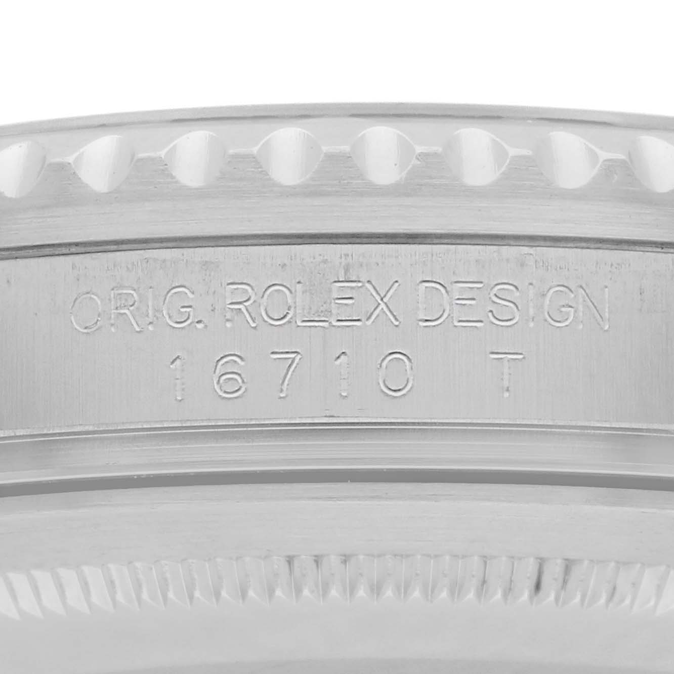 This image shows a close-up of the case side of a Rolex GMT-Master 16710 Men
s Stainless Steel Black Dial, highlighting its reference number engraving.