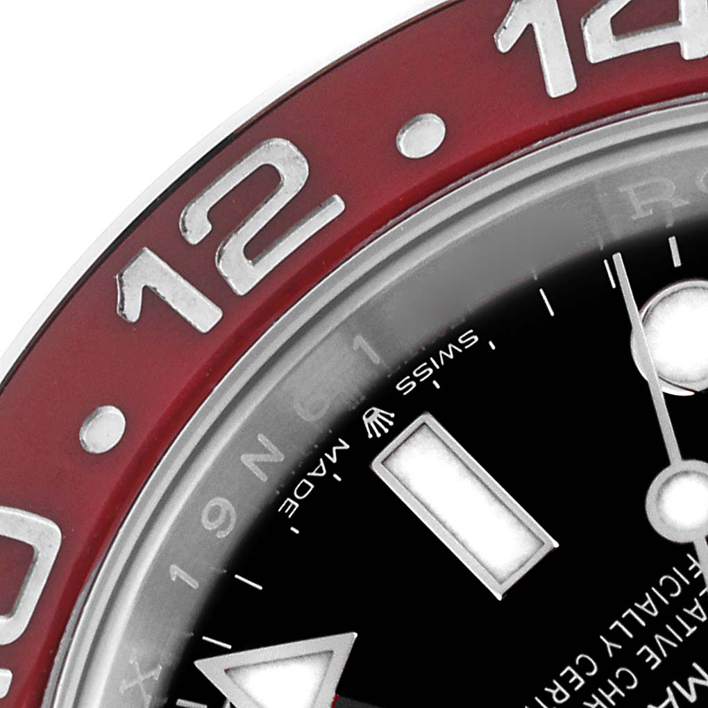 This image shows a close-up of the bezel and part of the dial of a Rolex GMT-Master 126710 Men's Stainless Steel Black Dial 126710 Men's Stainless Steel Black Dial watch.