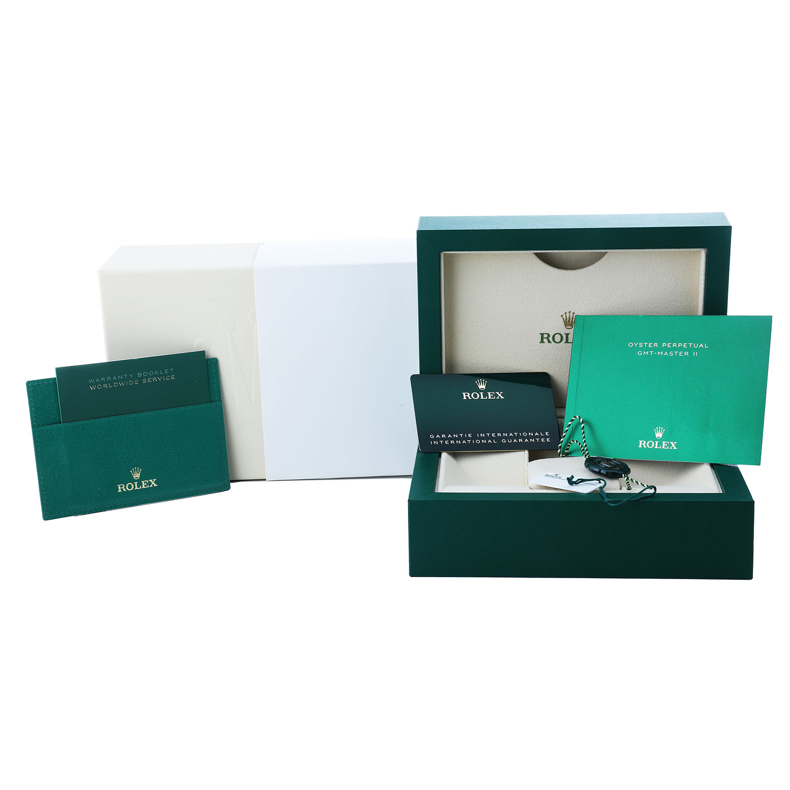 The image shows the packaging and accessories of a Rolex GMT-Master 126711 Men's Steel and Gold (two tone) Black Dial, including manuals, warranty card, and the watch box.