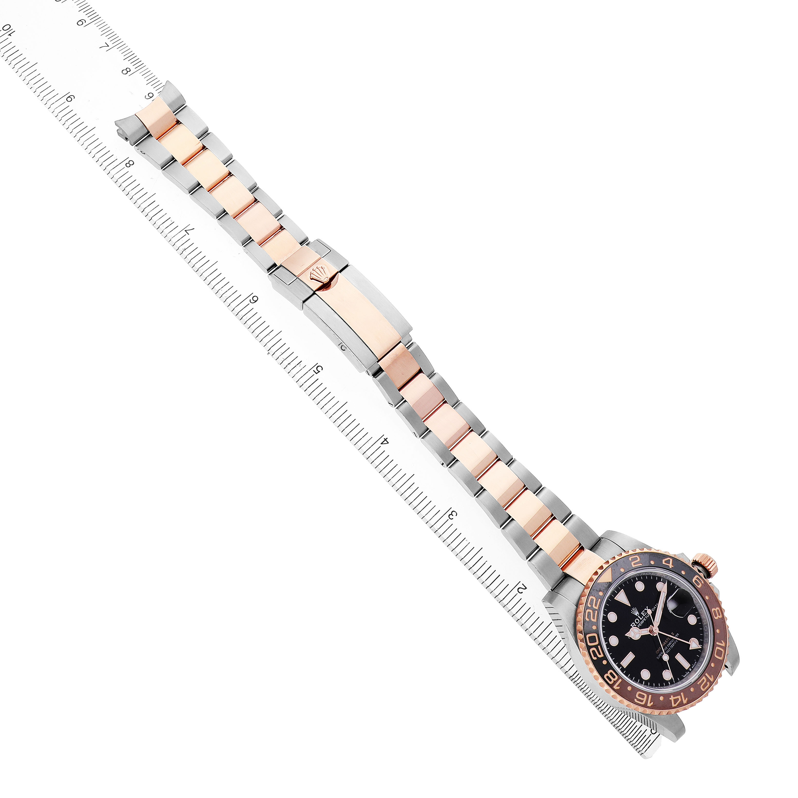 The Rolex GMT-Master 126711 Men's Steel and Gold (two tone) Black Dial watch is shown at a high angle, displaying its full bracelet, clasp, and bezel.